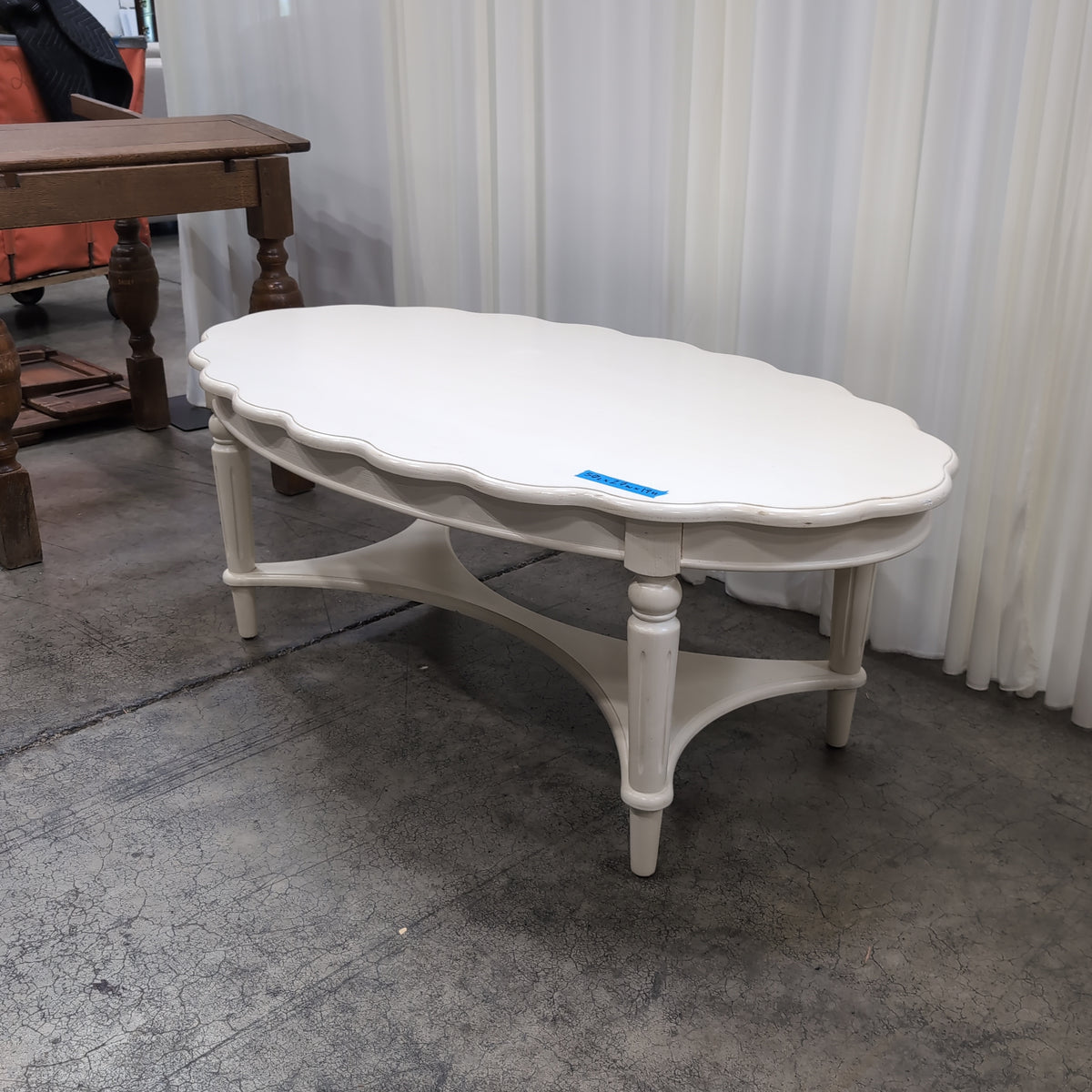 White Scalloped Oval Coffee Table