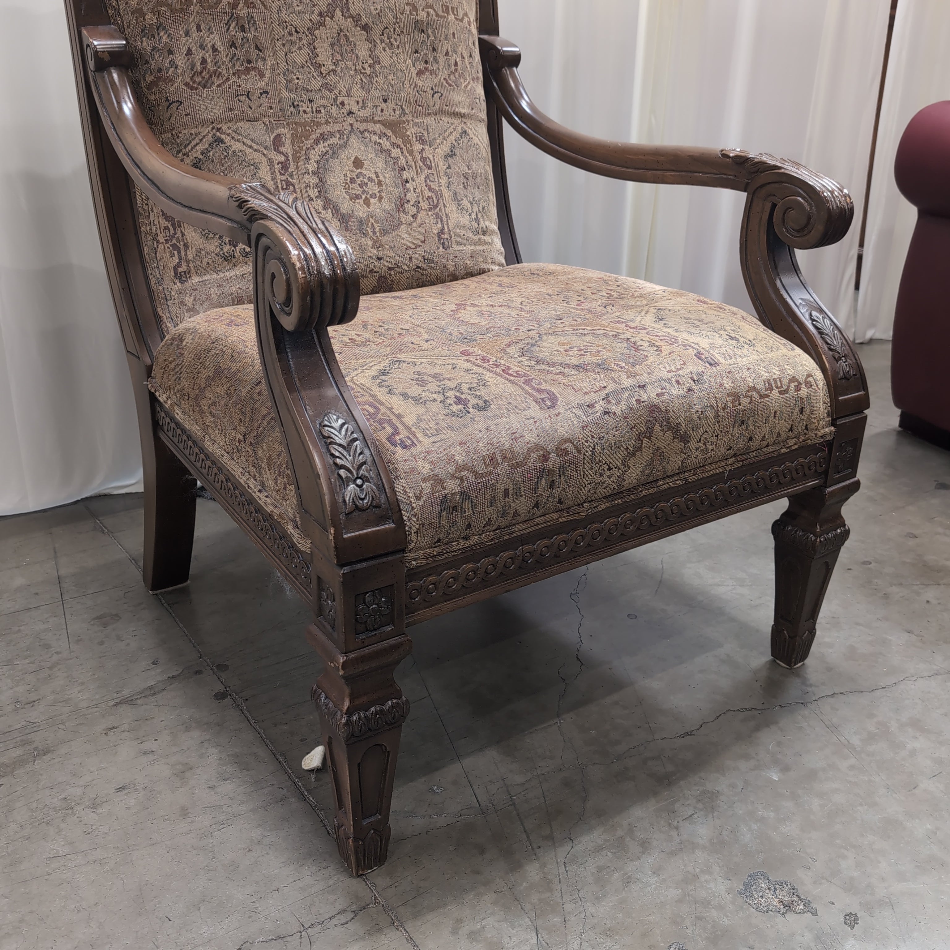 Traditional Carved Wood Accent Chair with Patterned Upholstery