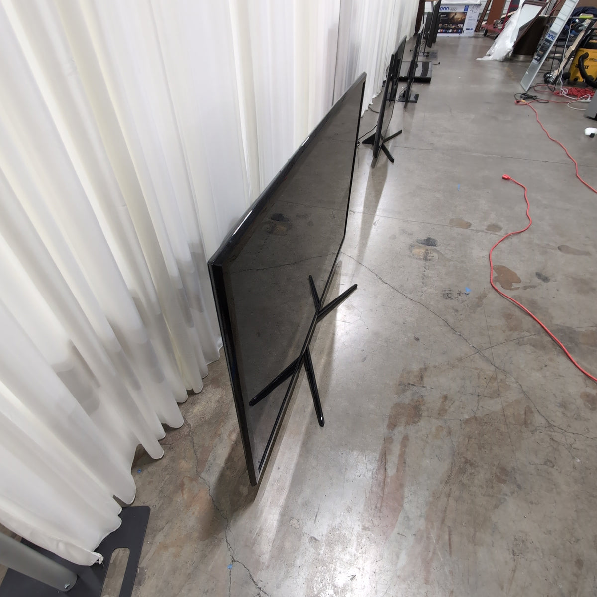 Samsung Black Flat Panel TV with Stand