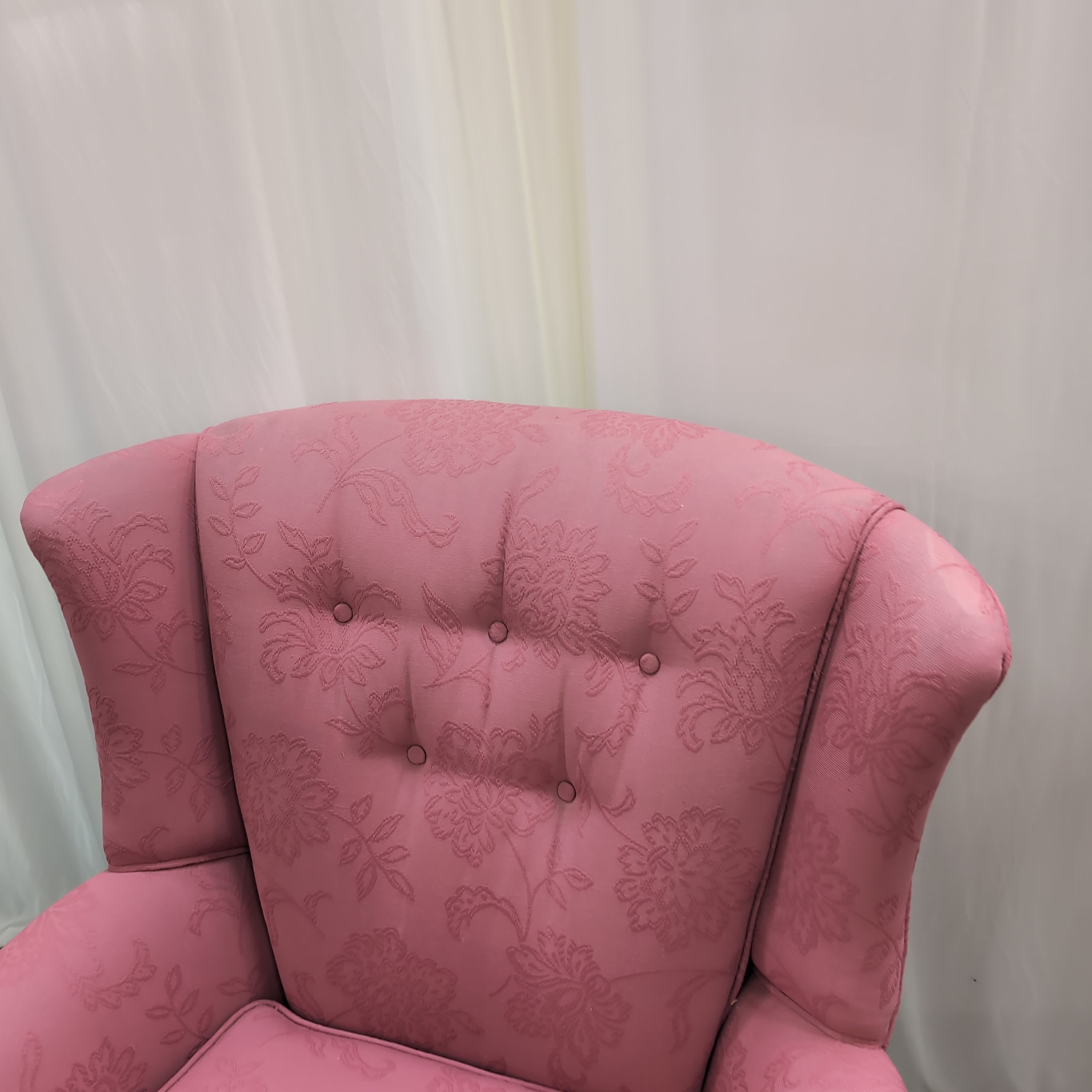 Pink Floral Upholstered Wingback Chair with Carved Wood Arms