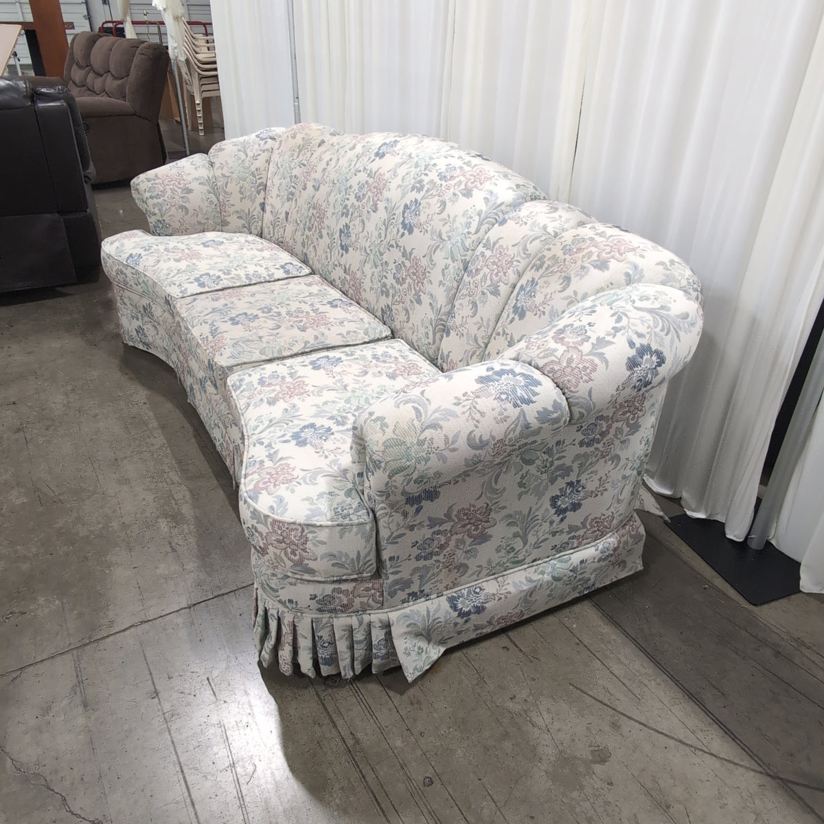 Floral Pattern Skirted Upholstered Couch with Rolled Arms