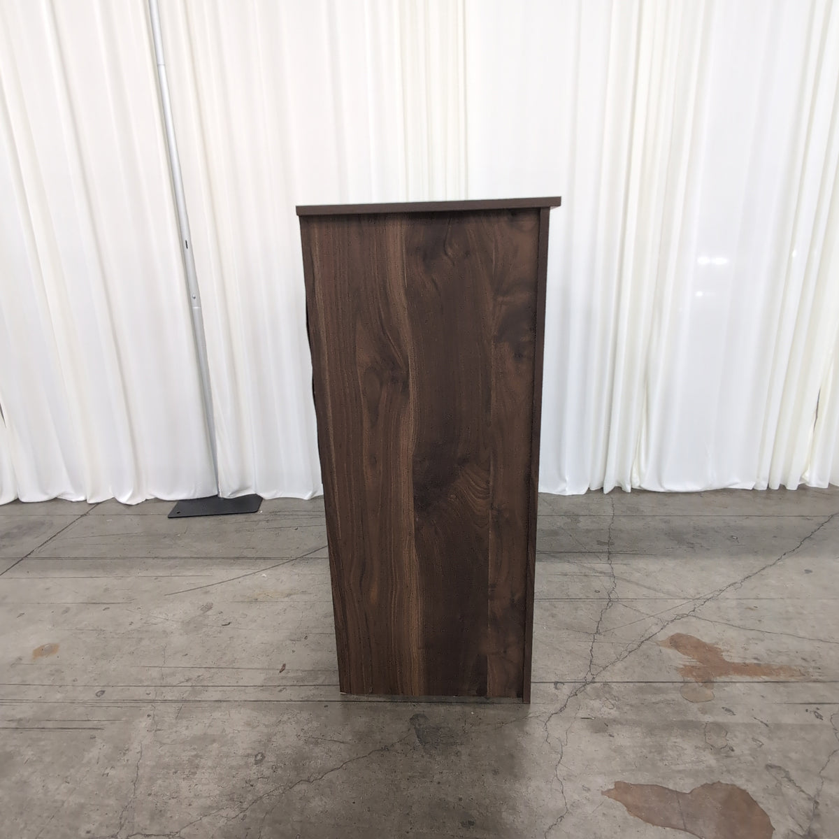 Dark Wood Four-Drawer Dresser with Metal Pulls