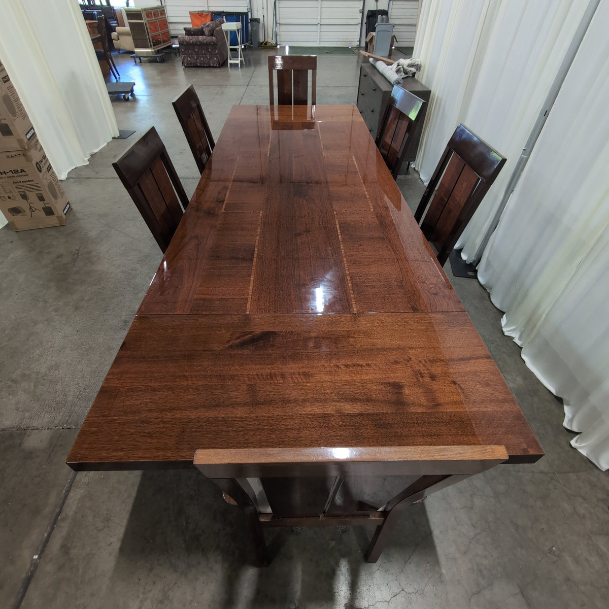 Chestnut brown dining table with 6 matching chairs