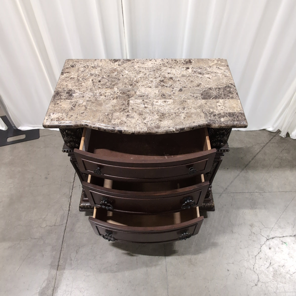 Ornate Dark Wood Three-Drawer Nightstand with Marble Top