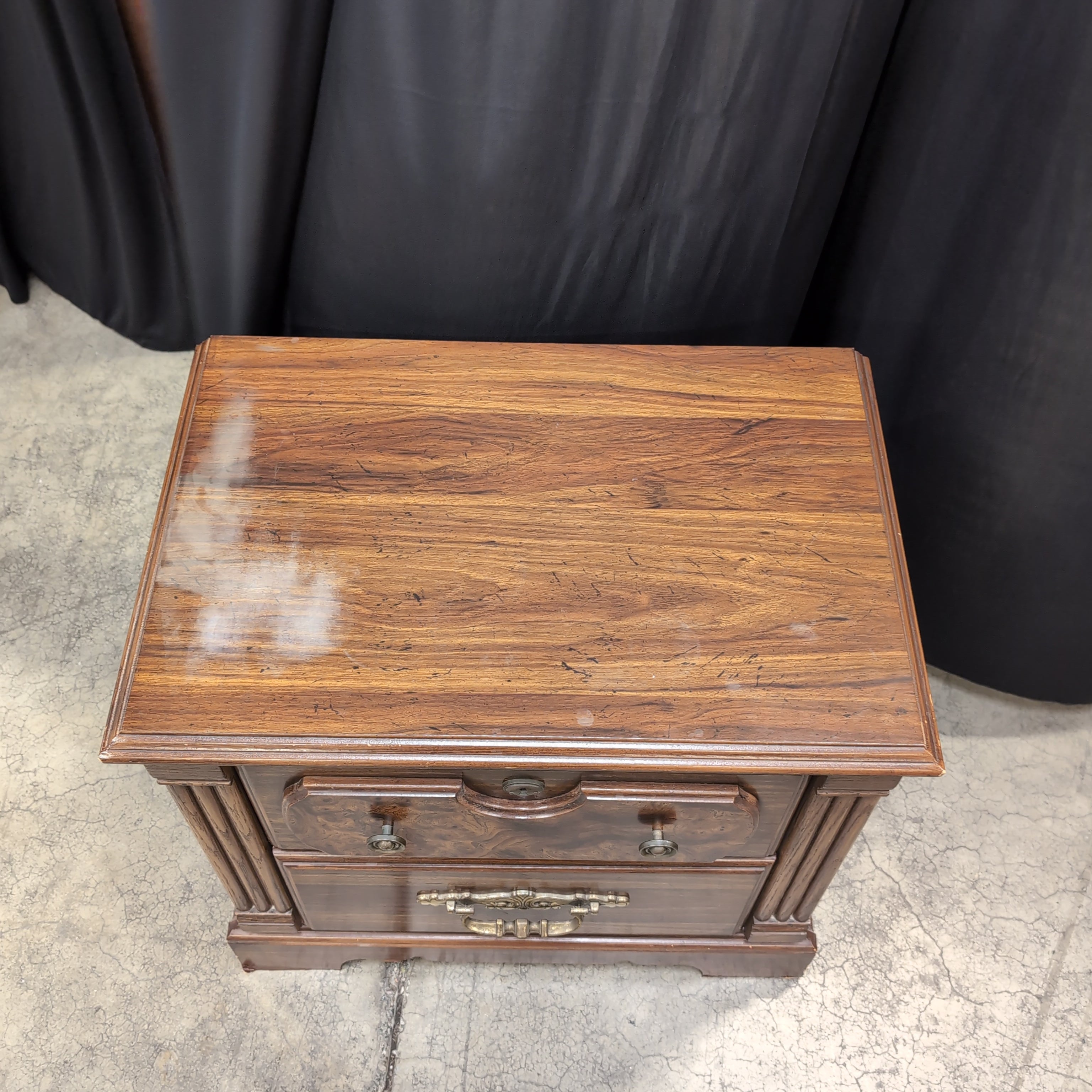 Traditional Dark Wood Two-Drawer Nightstand with Ornate Hardware