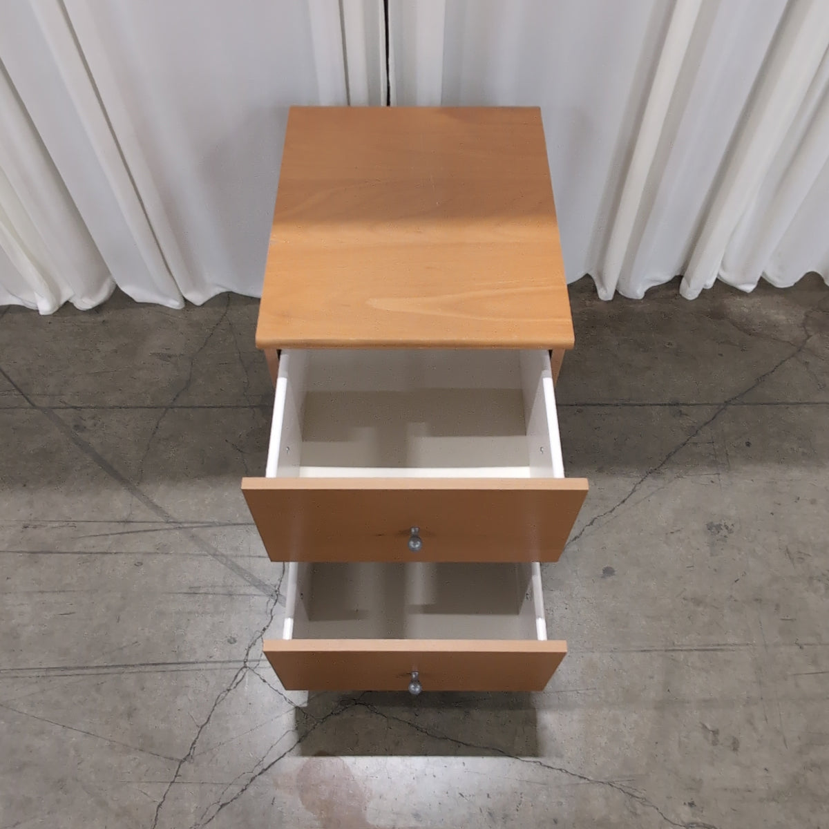 Light Wood Two-Drawer Nightstand with Silver Knobs
