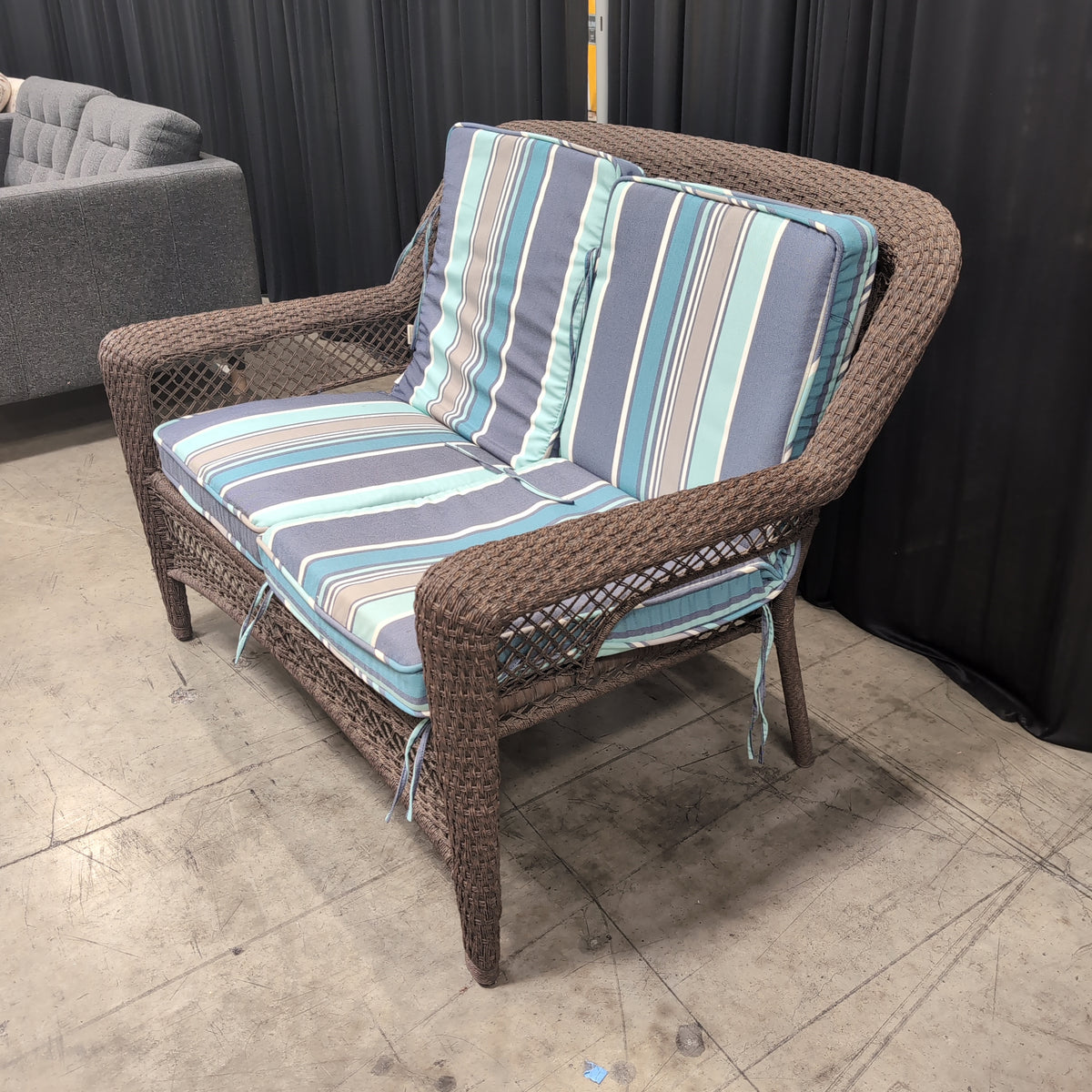 Dark brown wicker loveseat