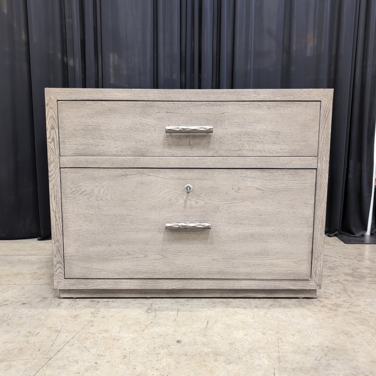 Light Wood Two-Drawer Nightstand with Textured Hardware