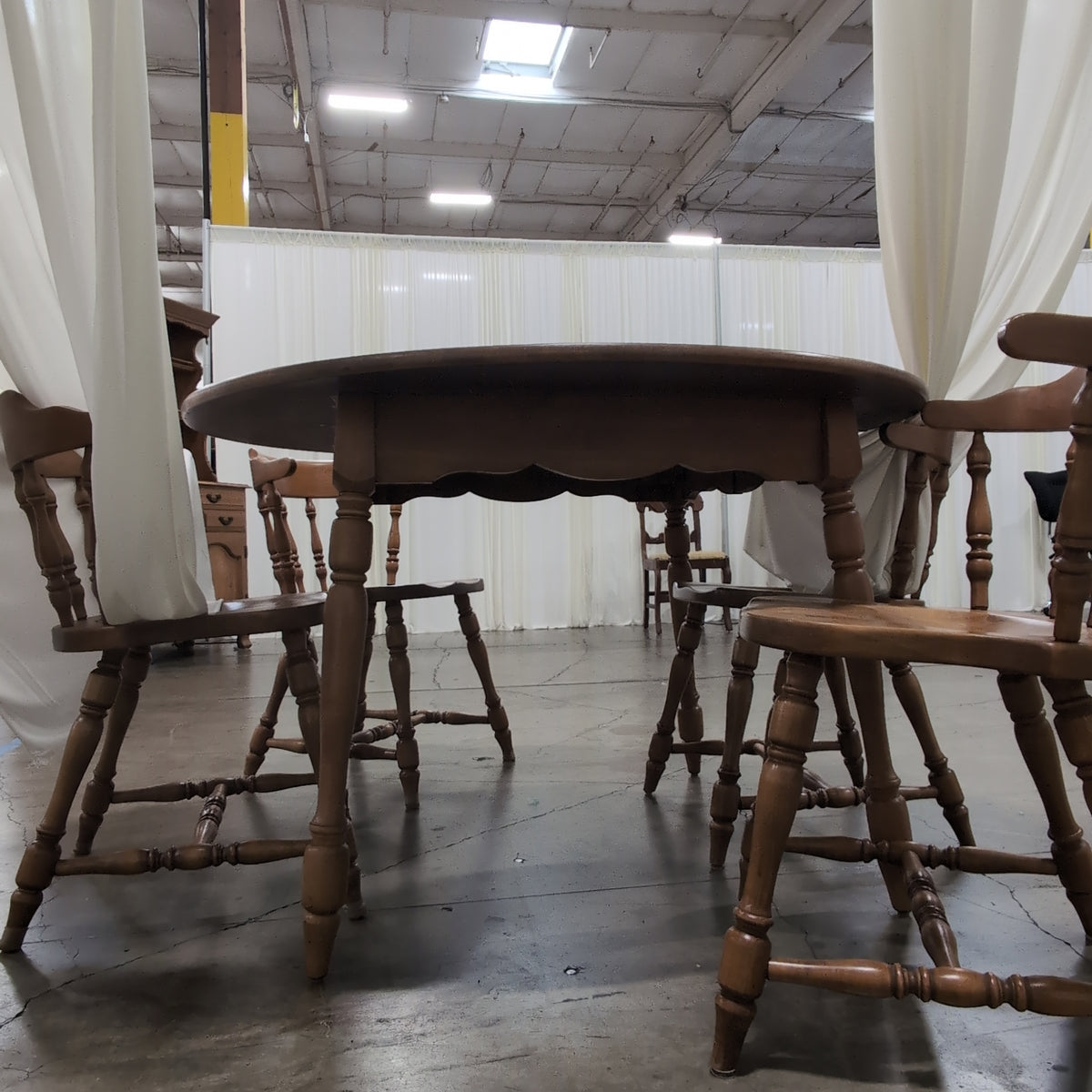 Round Medium Brown Wood Dining Table with Leaf Seam
