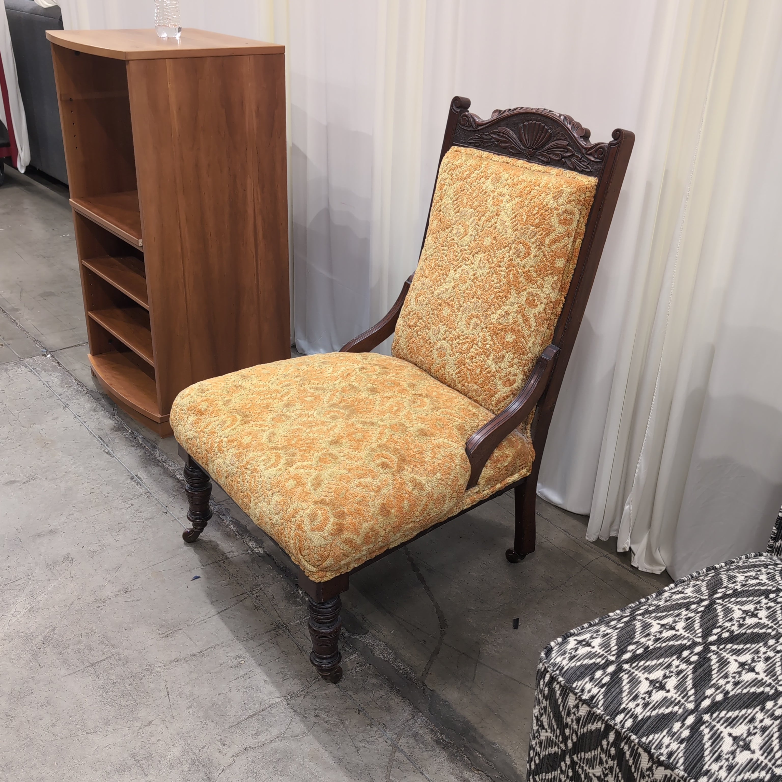 Carved Dark Wood Accent Chair with Patterned Upholstery