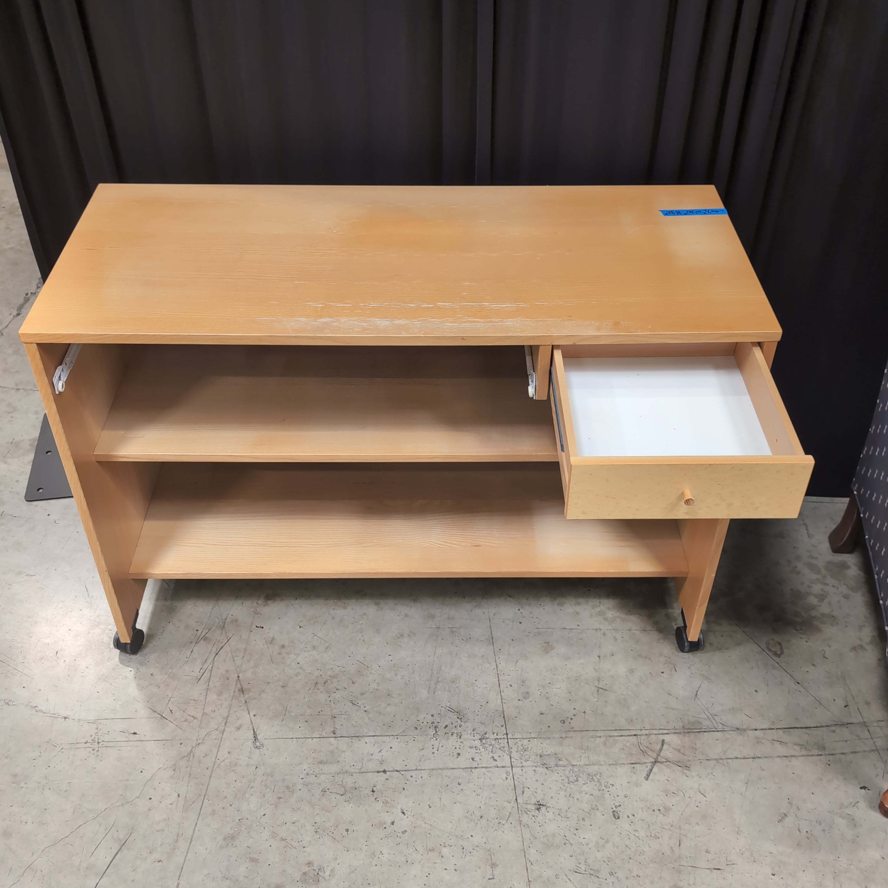 Light Wood Three-Shelf Bookcase with Casters