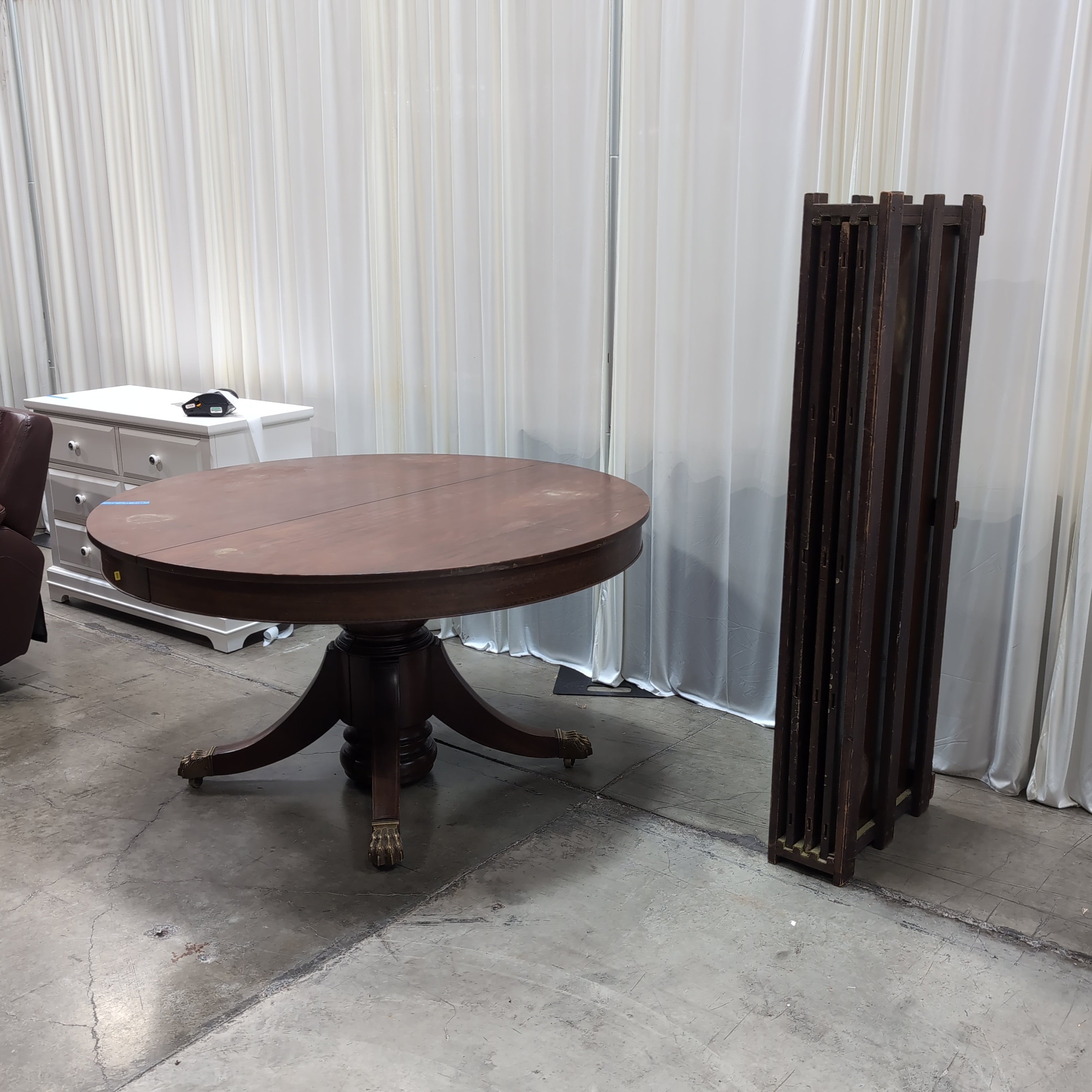Round Dark Wood Pedestal Dining Table with Claw Feet