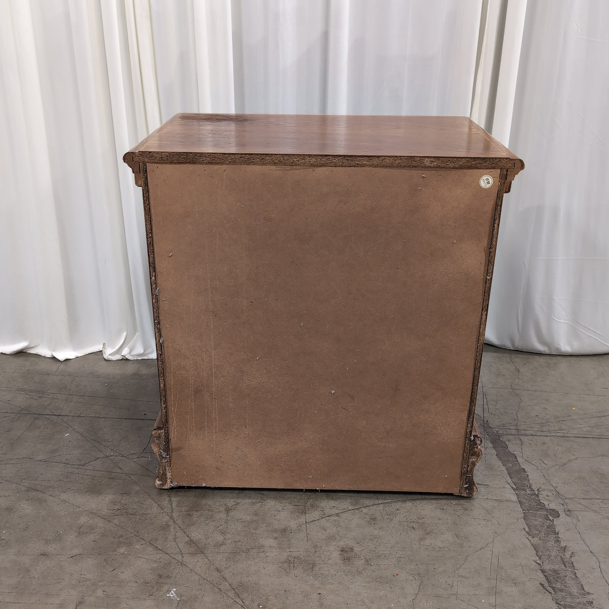 Traditional Brown Wood Three-Drawer Nightstand with Ornate Hardware