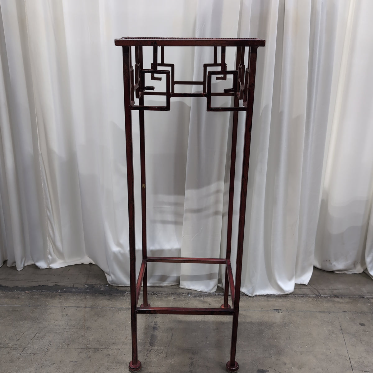 Burgundy Metal Display Stand with Patterned Top