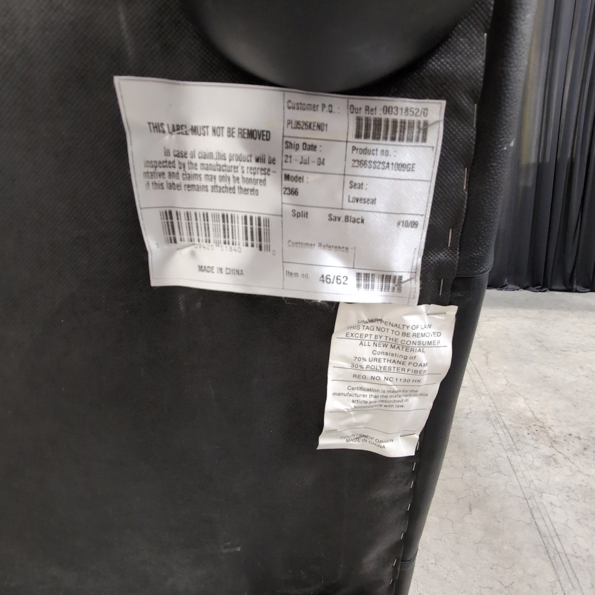 Black Leather Three-Seat Couch with Padded Arms