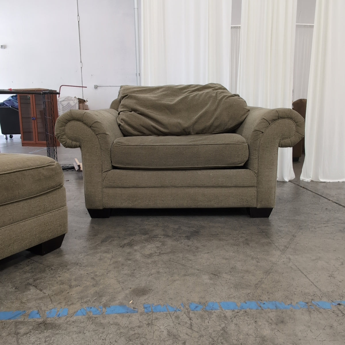 Sage Green Fabric Couch with Paisley Throw Pillows