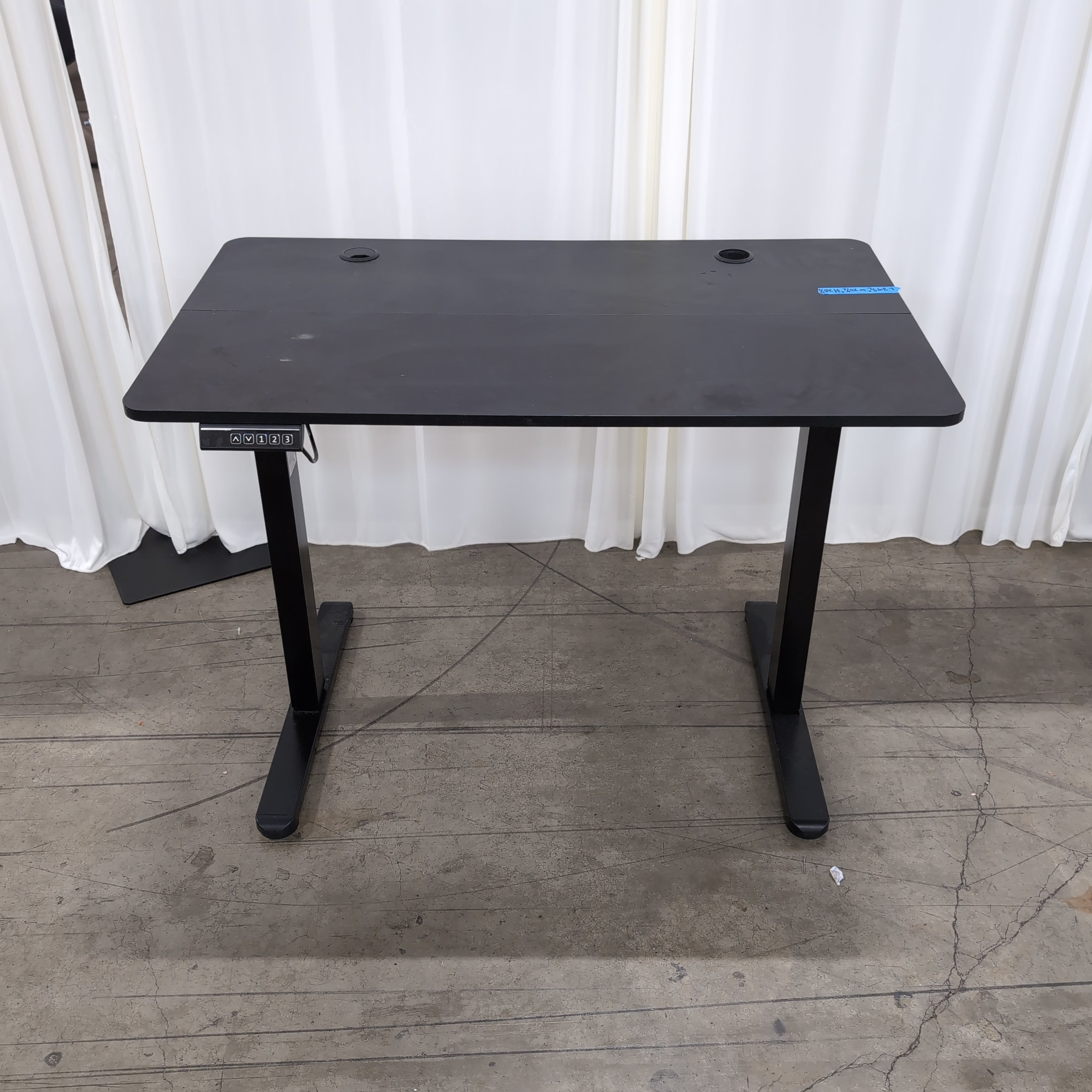 Black Electric Height-Adjustable Desk with Grommet Holes
