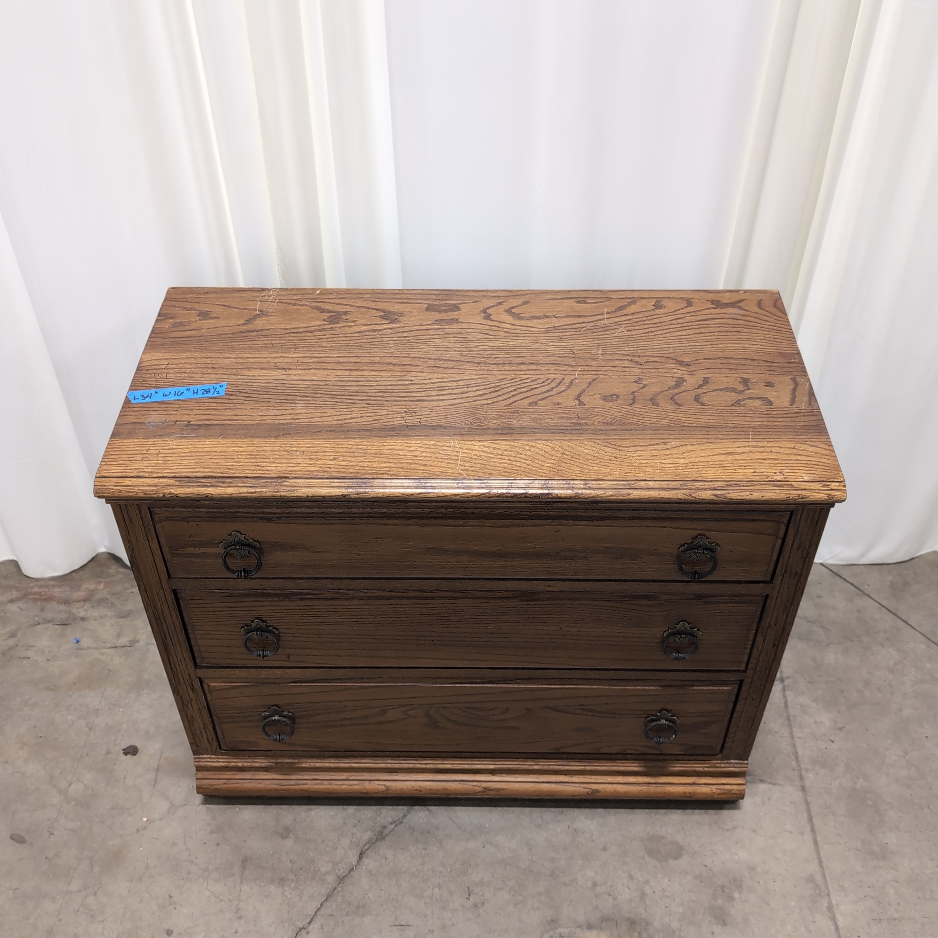 Traditional Brown Wood Three-Drawer Dresser with Ornate Hardware