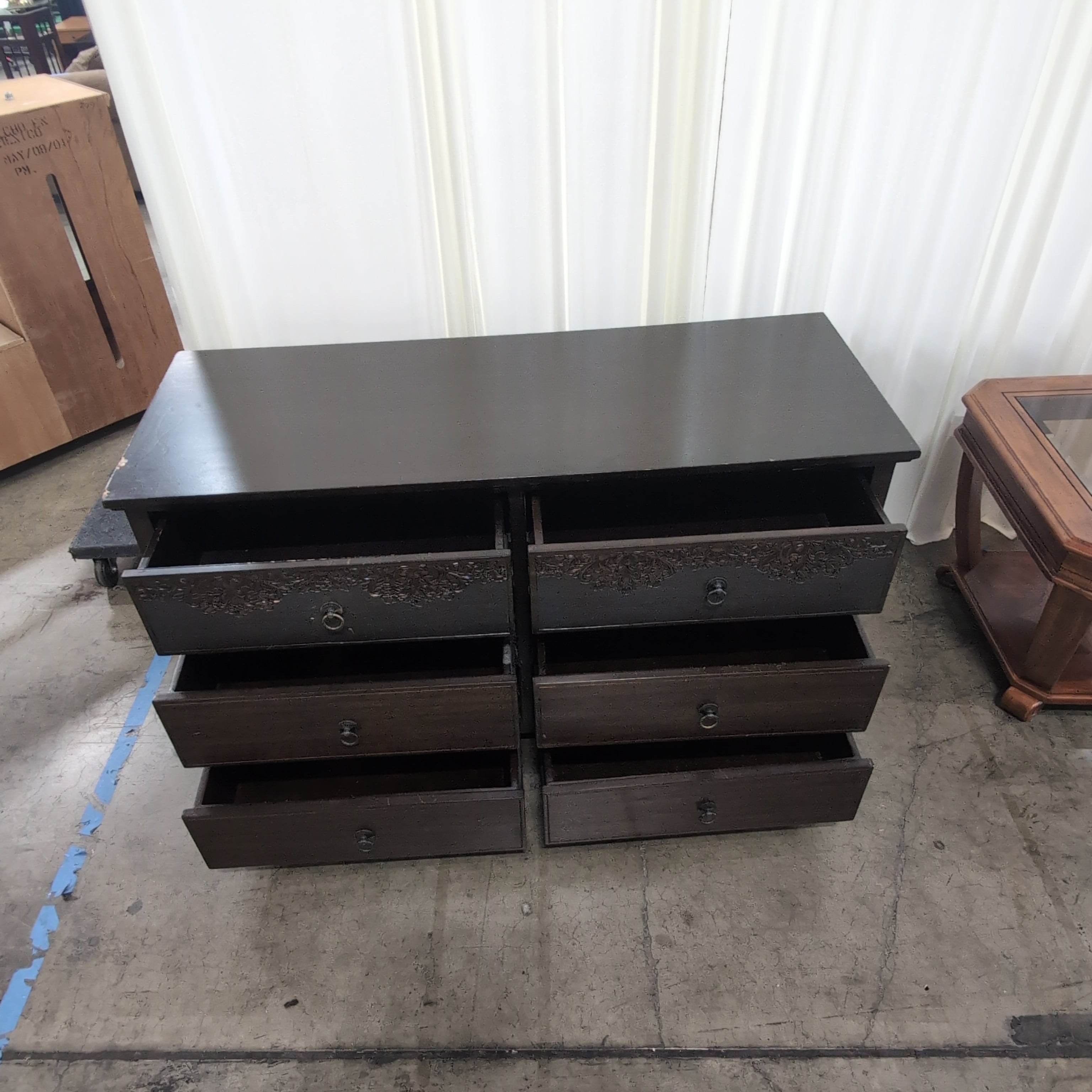Dark Brown Six-Drawer Dresser with Ornate Carvings