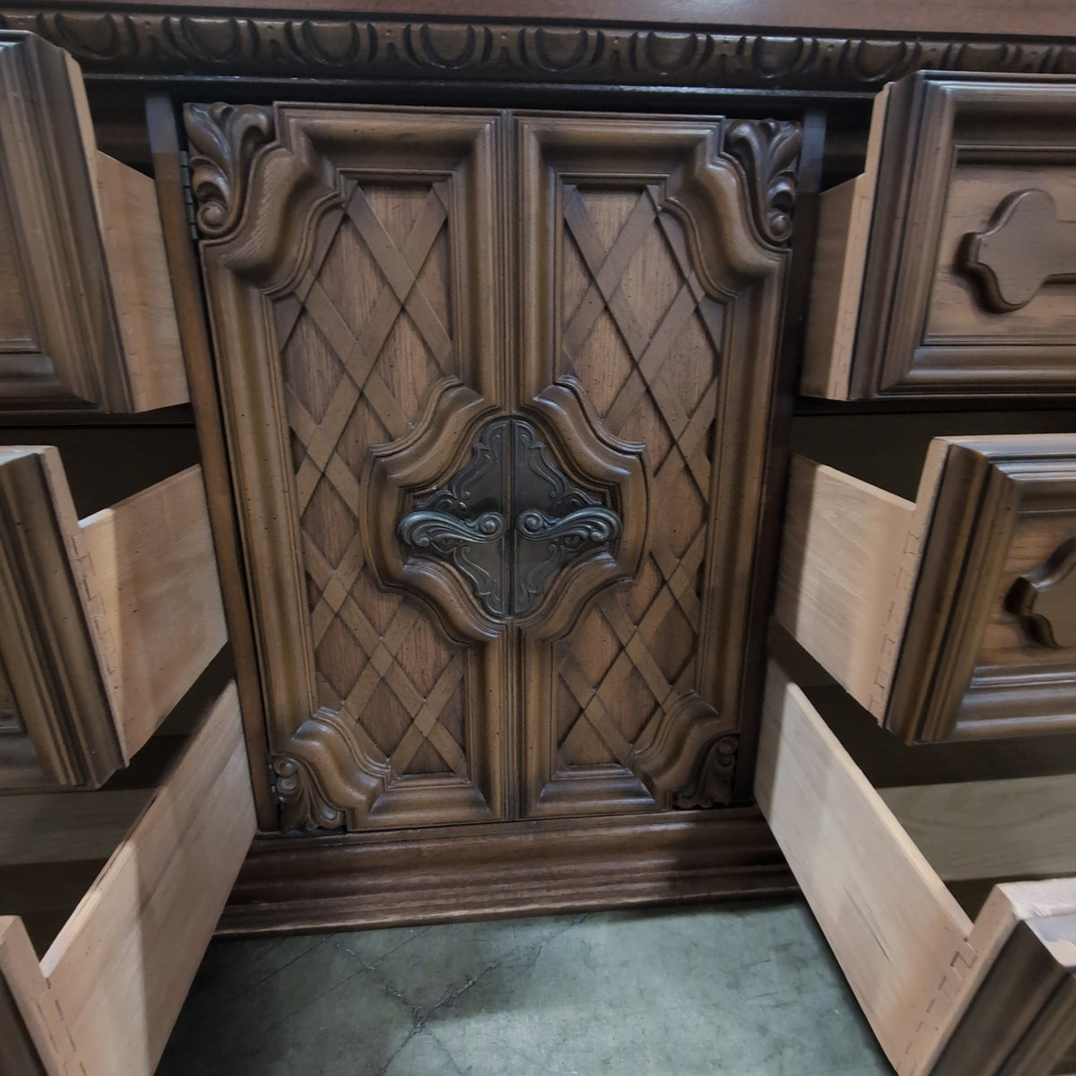 Traditional Brown Wood Dresser with Ornate Hardware