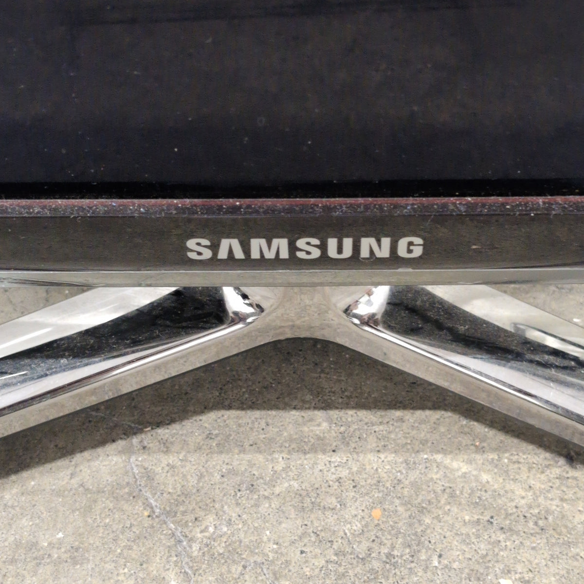 Samsung Black Flat Screen TV with Arch Stand