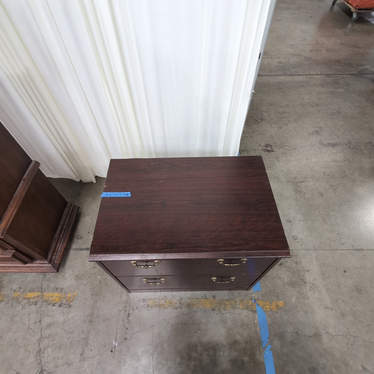 Dark Wood Two-Drawer Dresser with Ornate Hardware