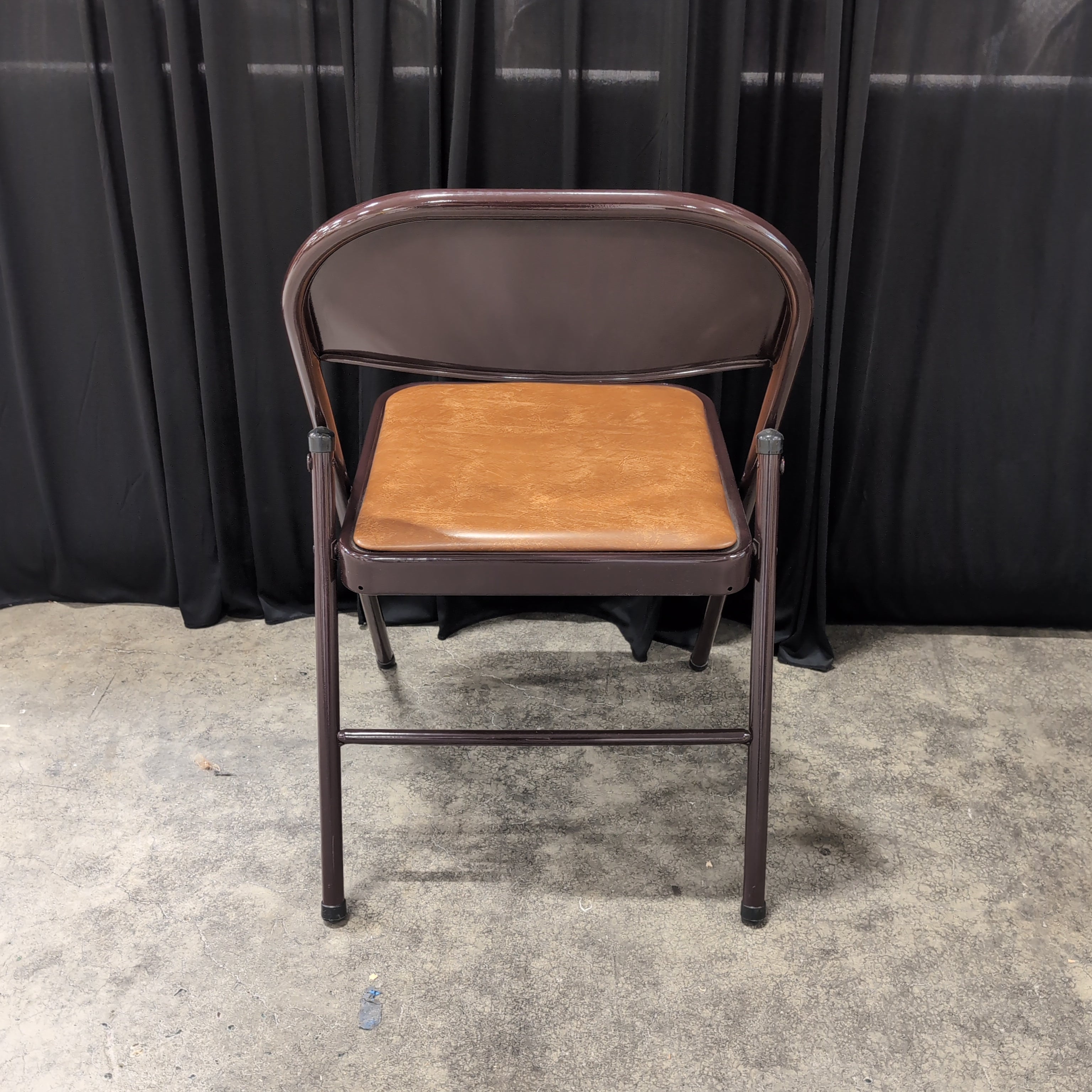 Brown Metal Folding Chair with Tan Upholstered Seat