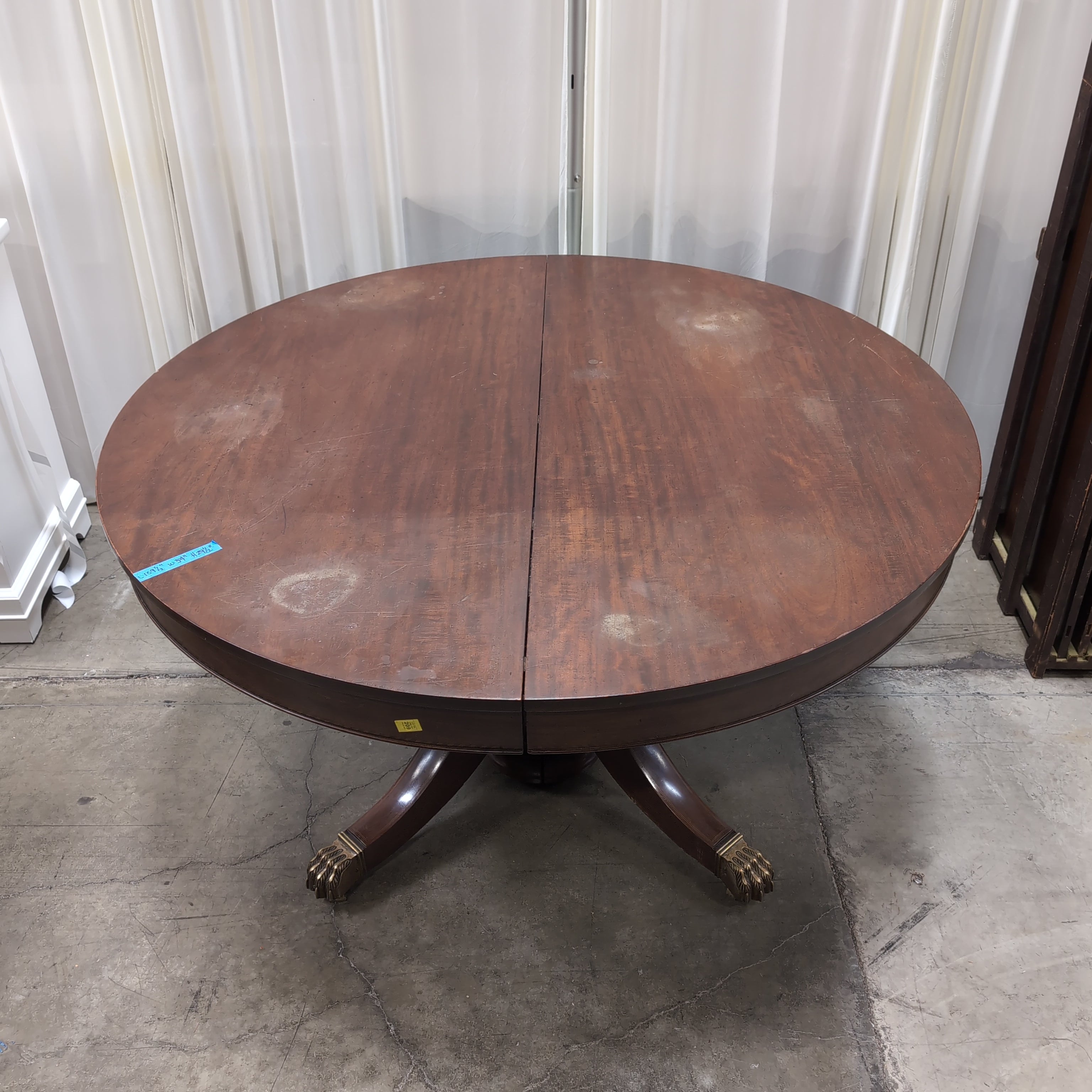 Round Dark Wood Pedestal Dining Table with Claw Feet