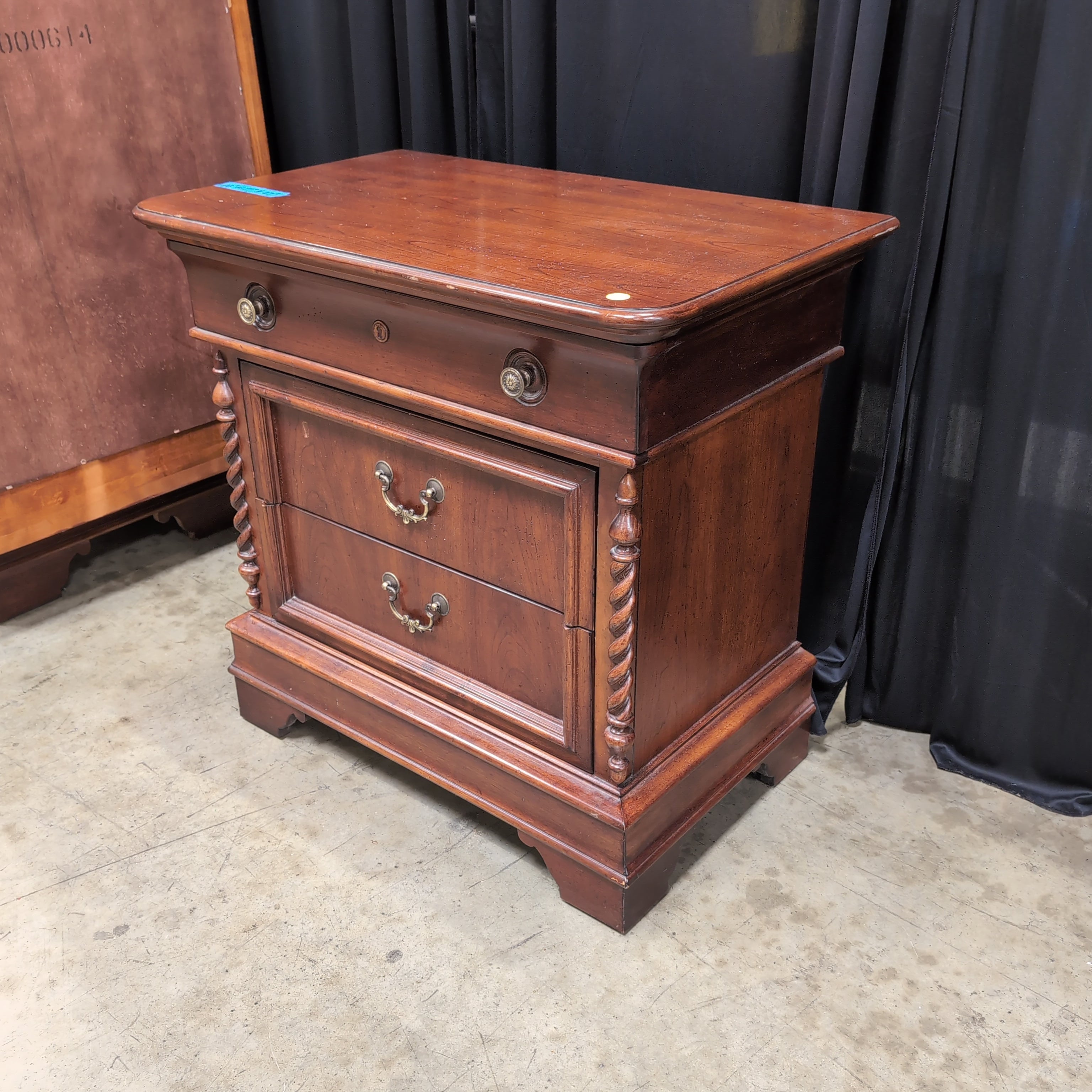 Cherry Finish Wood Nightstand with Ornate Hardware