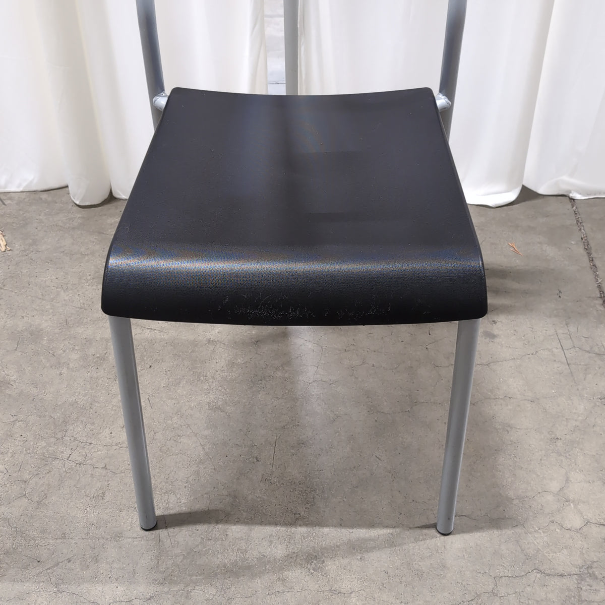 Black Plastic Stackable Chair with Striped Cushion