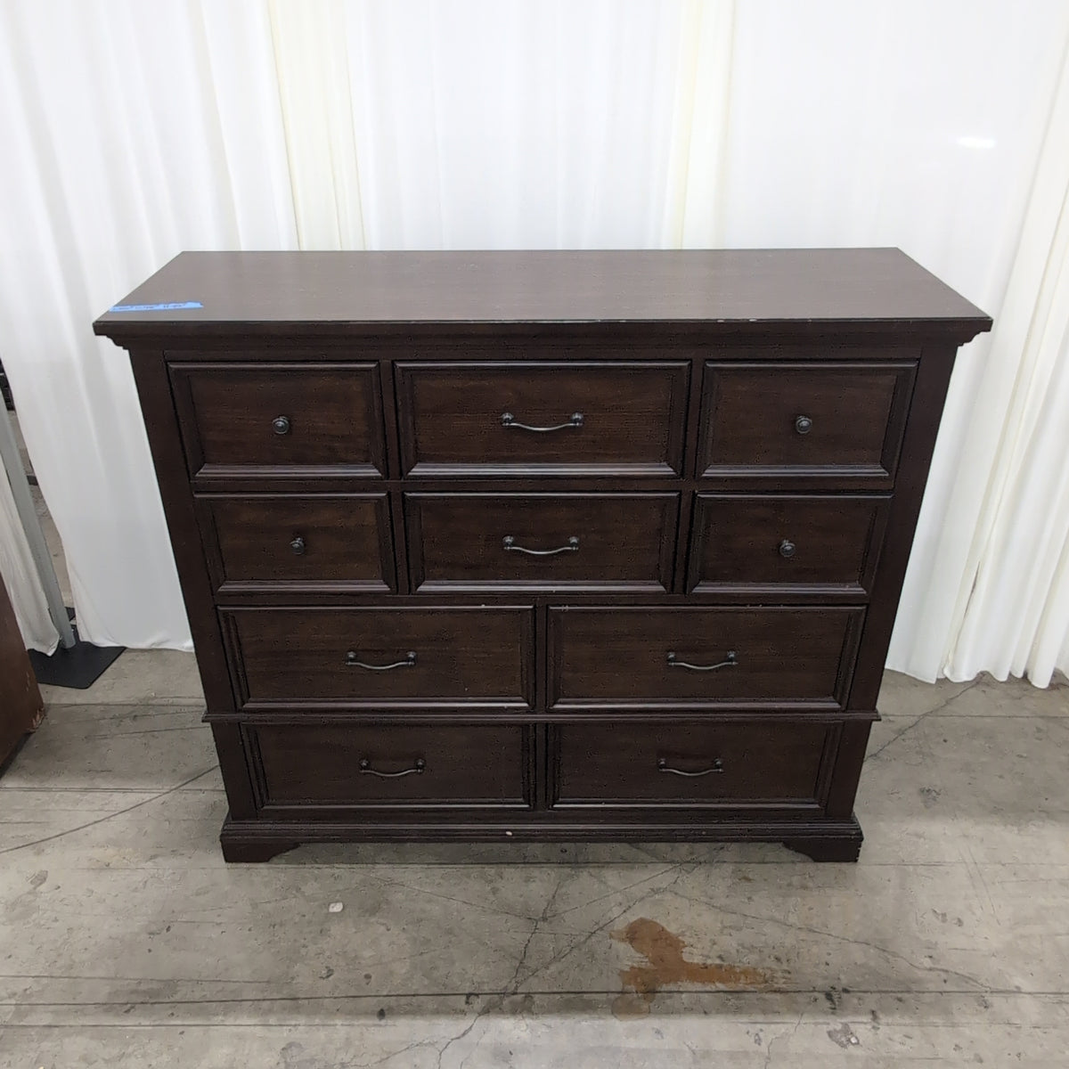 Dark Brown Wood Eight-Drawer Dresser with Ornate Hardware