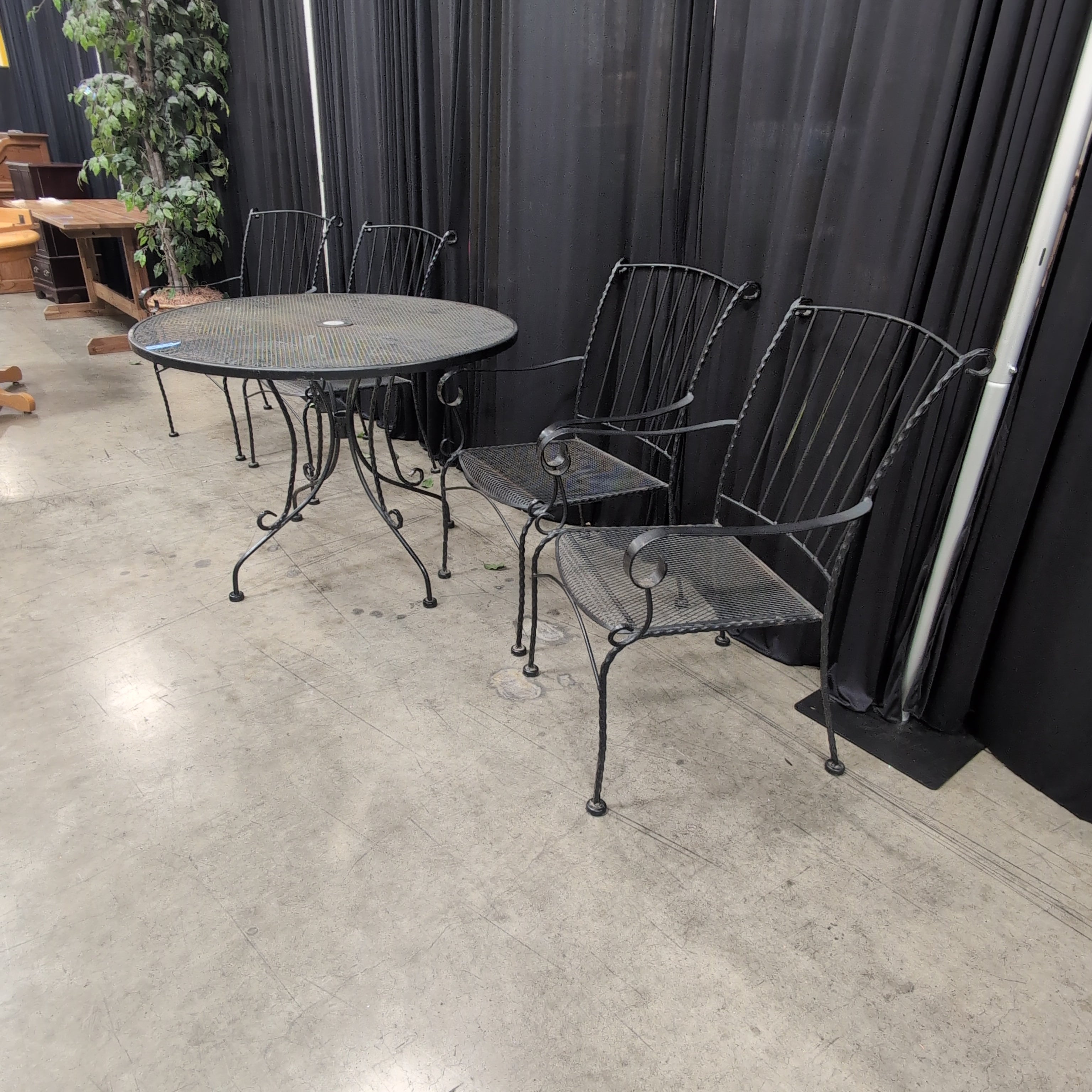 Black Wrought Iron Round Outdoor Table and Four Chairs