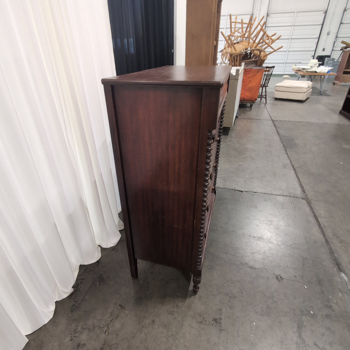 Dark Wood Four-Drawer Dresser with Turned Columns