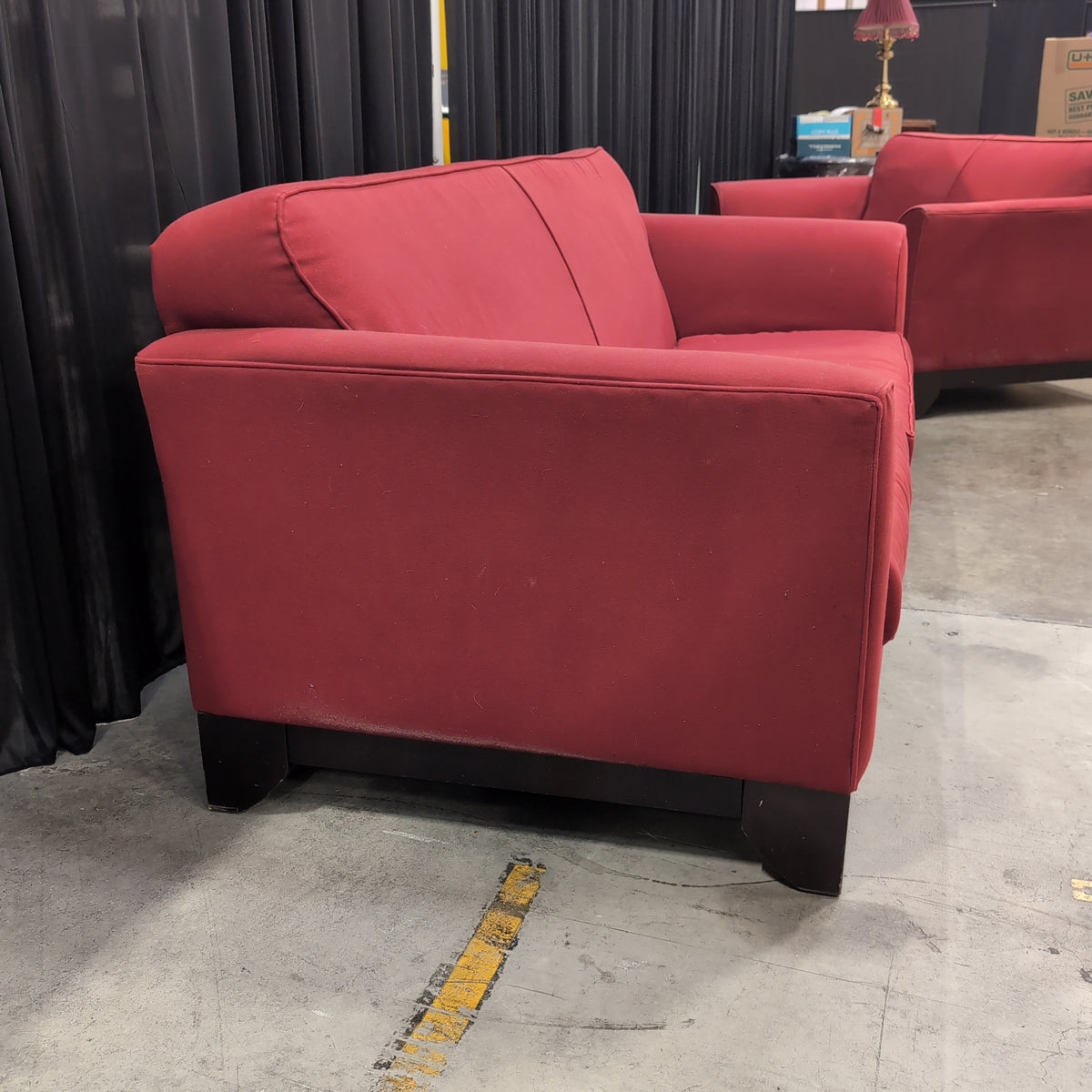 Red Fabric Upholstered Two-Cushion Couch
