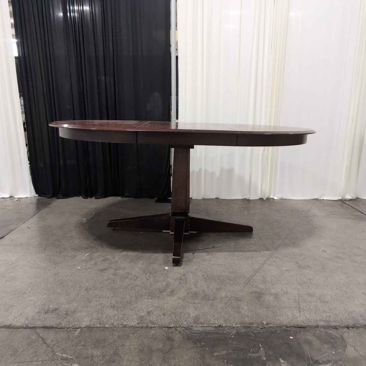 Cherry Tone Oval Wood Dining Table with Center Leaf