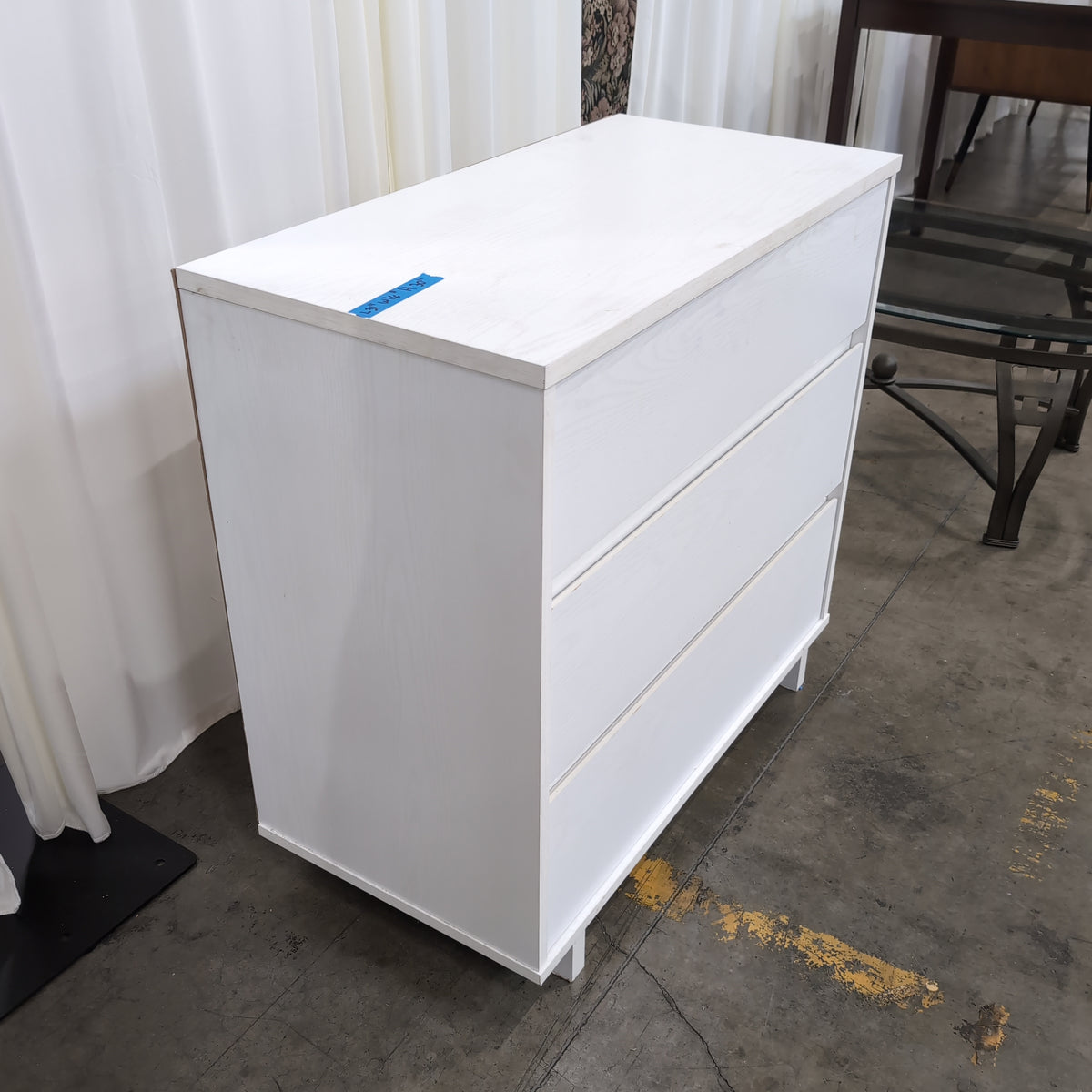White Three-Drawer Dresser in Wood Finish