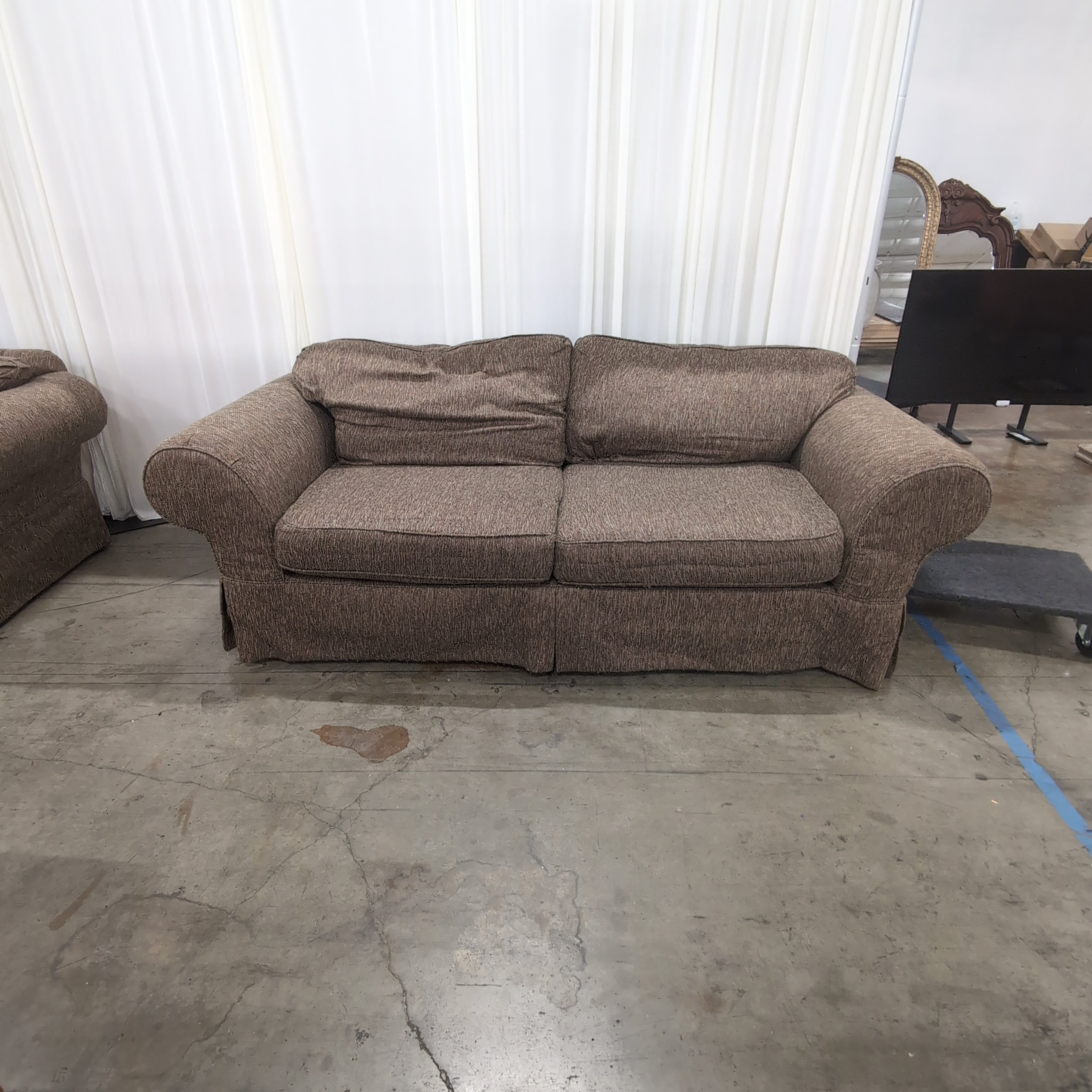 Textured Brown Rolled Arm Couch with Skirted Base
