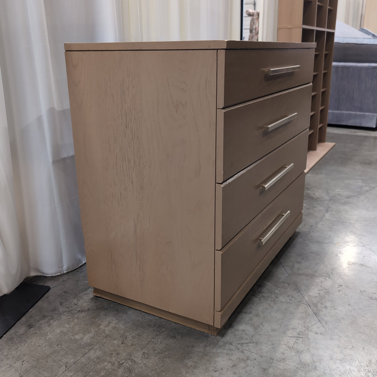 Light Wood Four-Drawer Dresser with Silver Bar Pulls