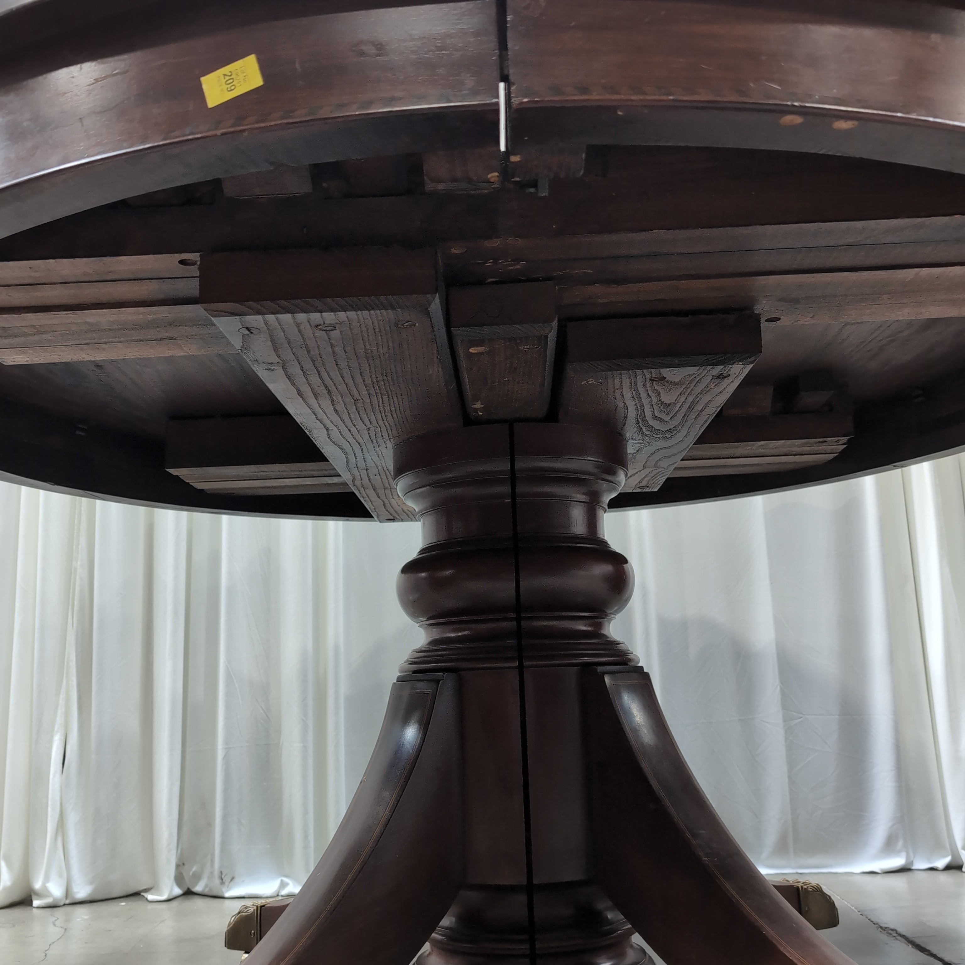 Round Dark Wood Pedestal Dining Table with Claw Feet
