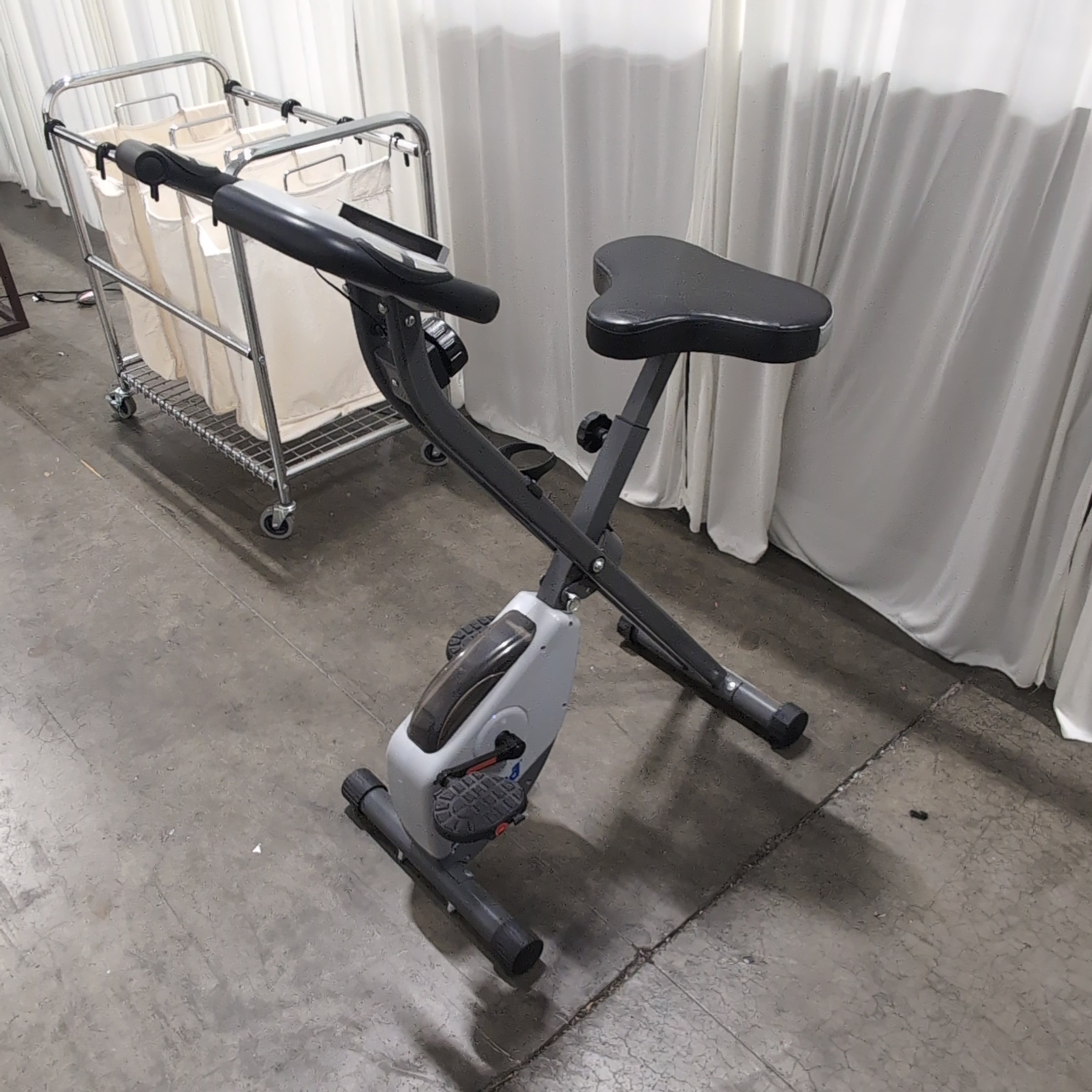 Compact Black Stationary Exercise Bike with Adjustable Seat