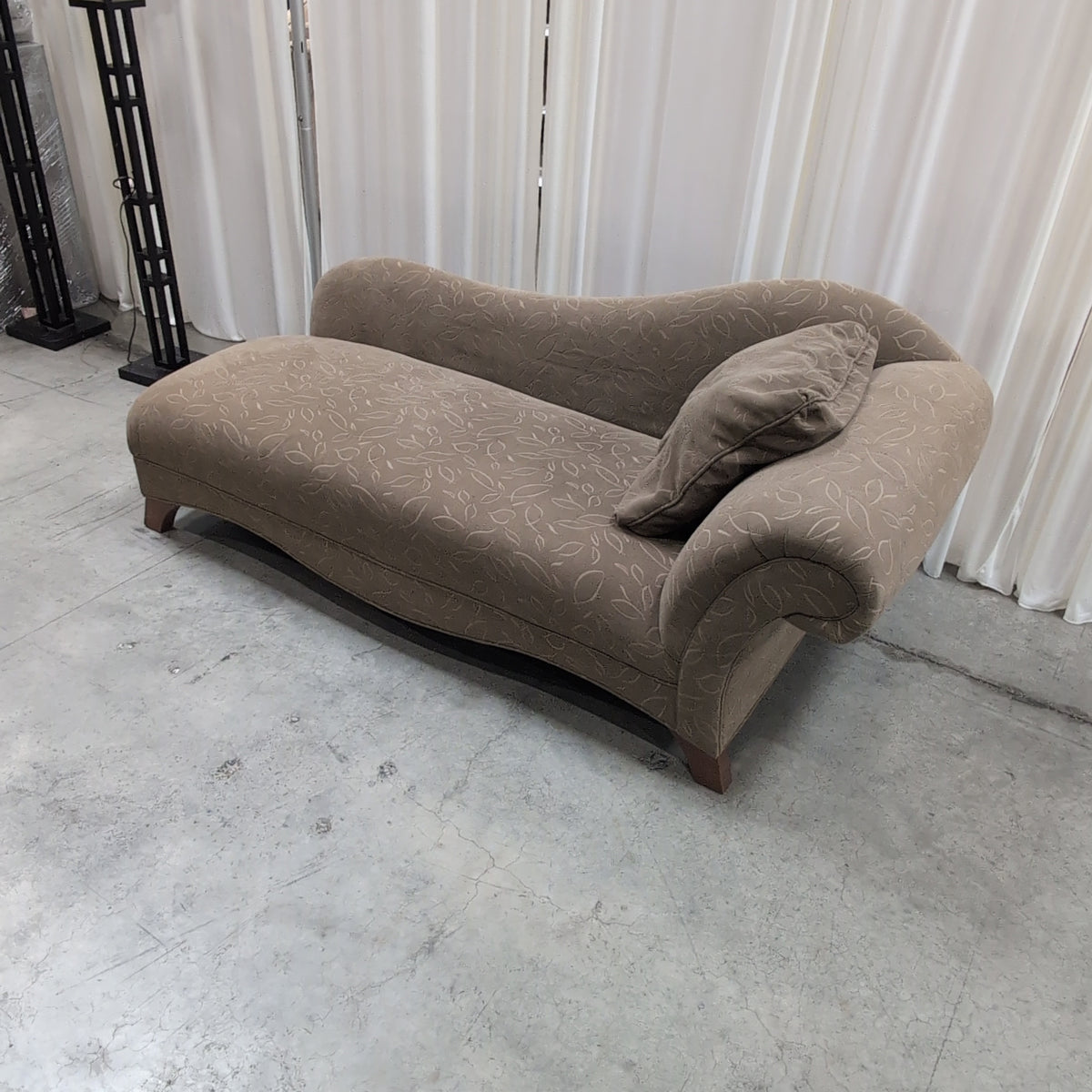 Tan Upholstered Chaise Lounge with Leaf Pattern