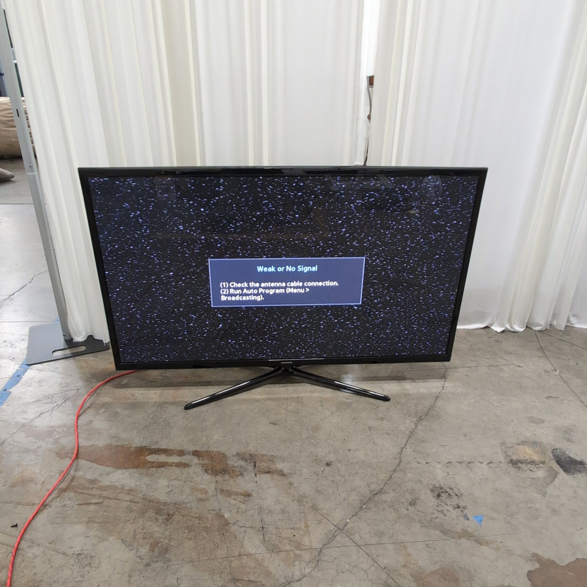 Samsung Black Flat Panel TV with Stand