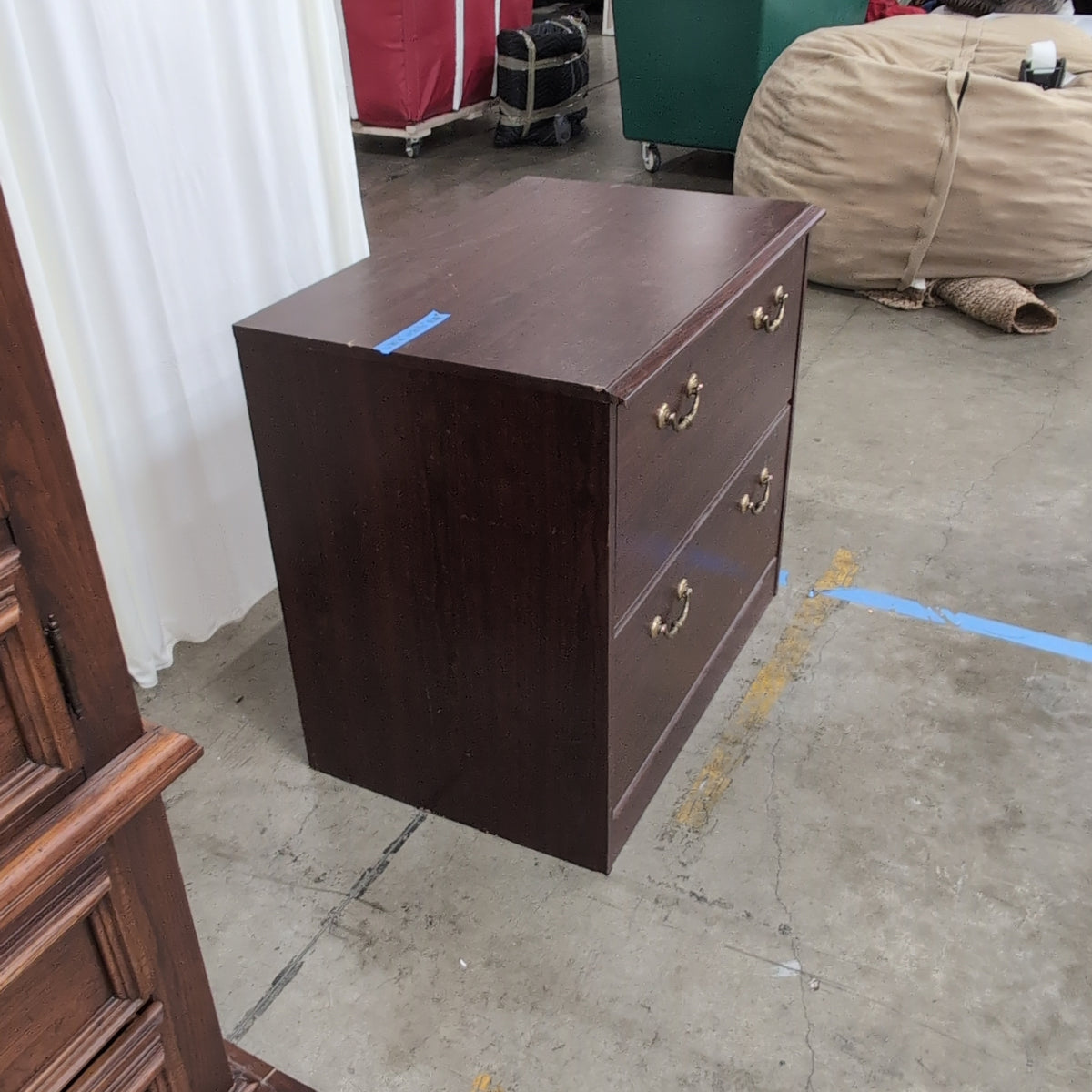 Dark Wood Two-Drawer Dresser with Ornate Hardware