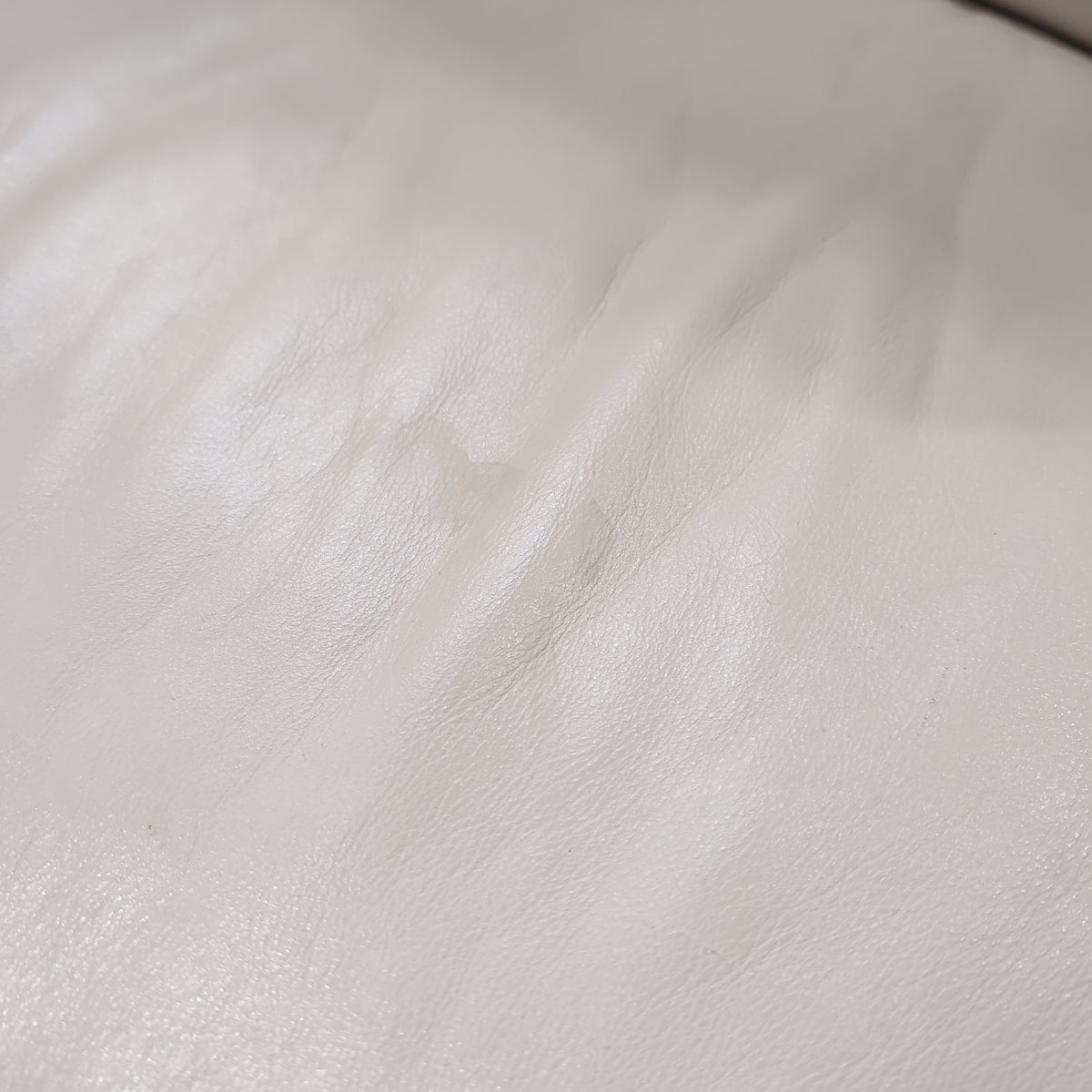 Cream-Colored Three-Seat Padded Couch