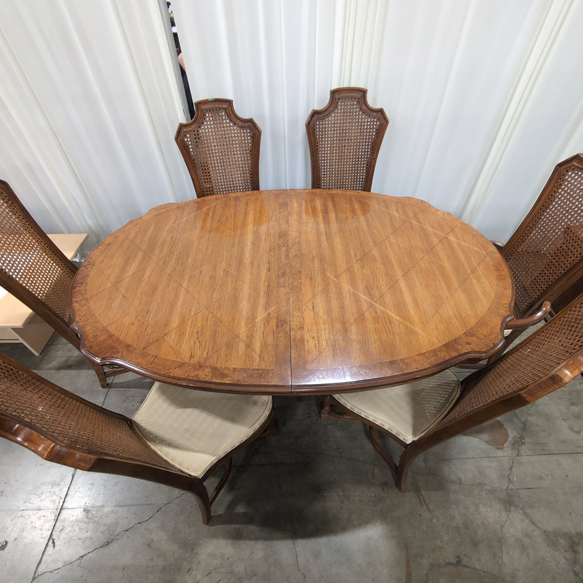 Ornate Brown Wood Dining Table With Six Cane Back Chairs