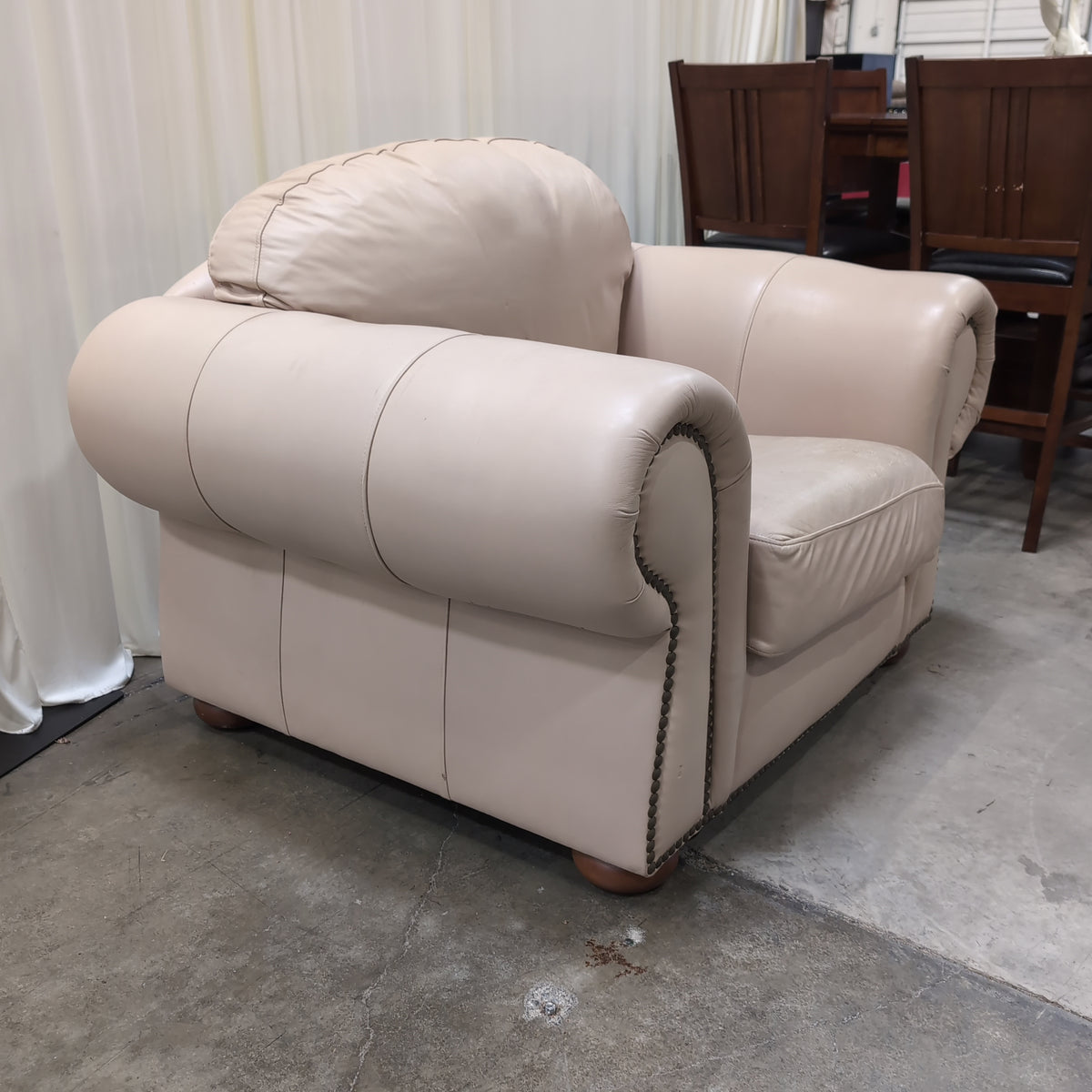 Padded Tan Armchair with Rolled Arms