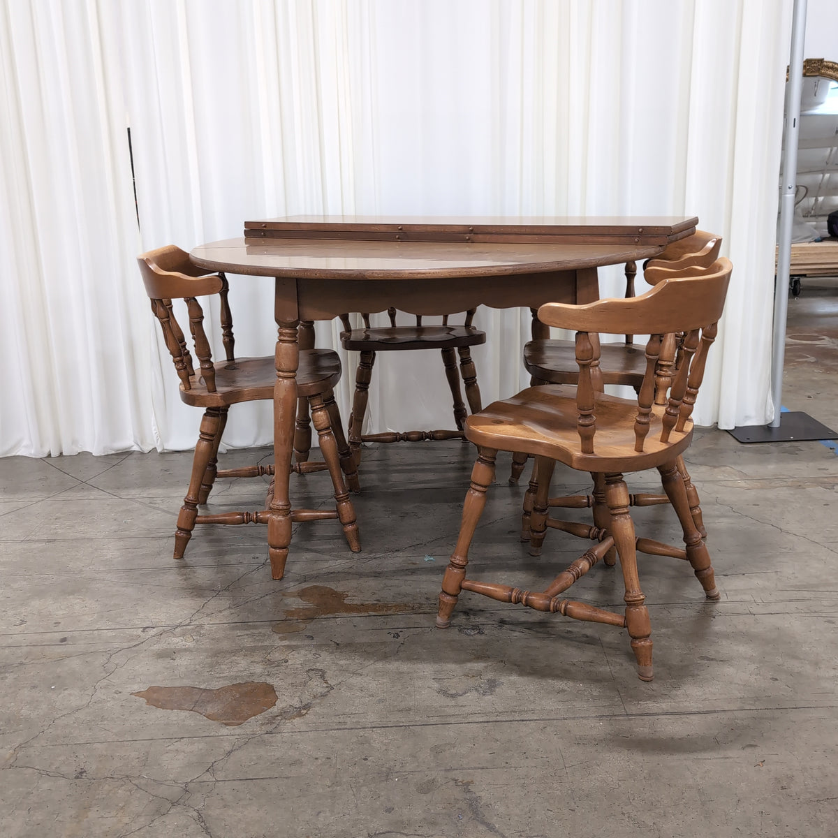 Round Medium Brown Wood Dining Table with Leaf Seam