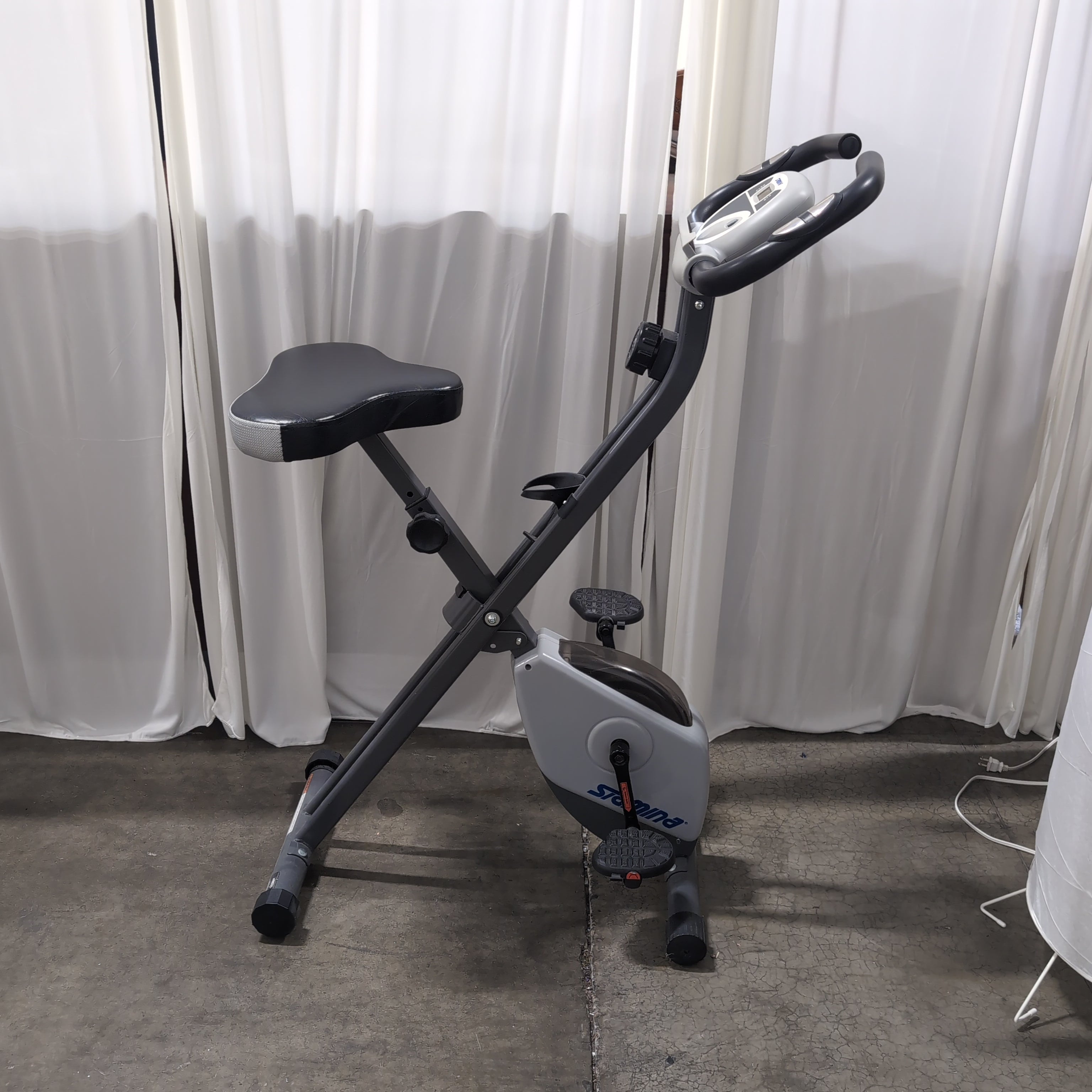 Compact Black Stationary Exercise Bike with Adjustable Seat