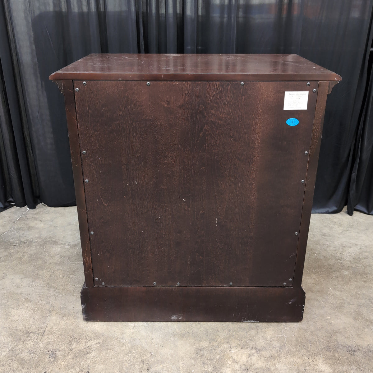 Dark Hardwood Three-Drawer Nightstand with Turned Columns