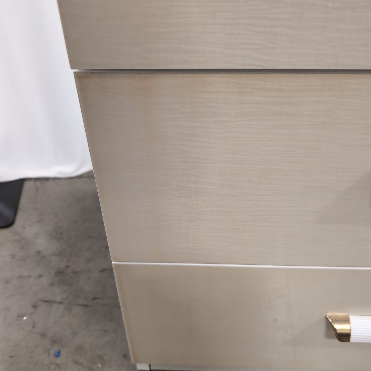 Light Beige Glossy Three-Drawer Nightstand with Ribbed Top